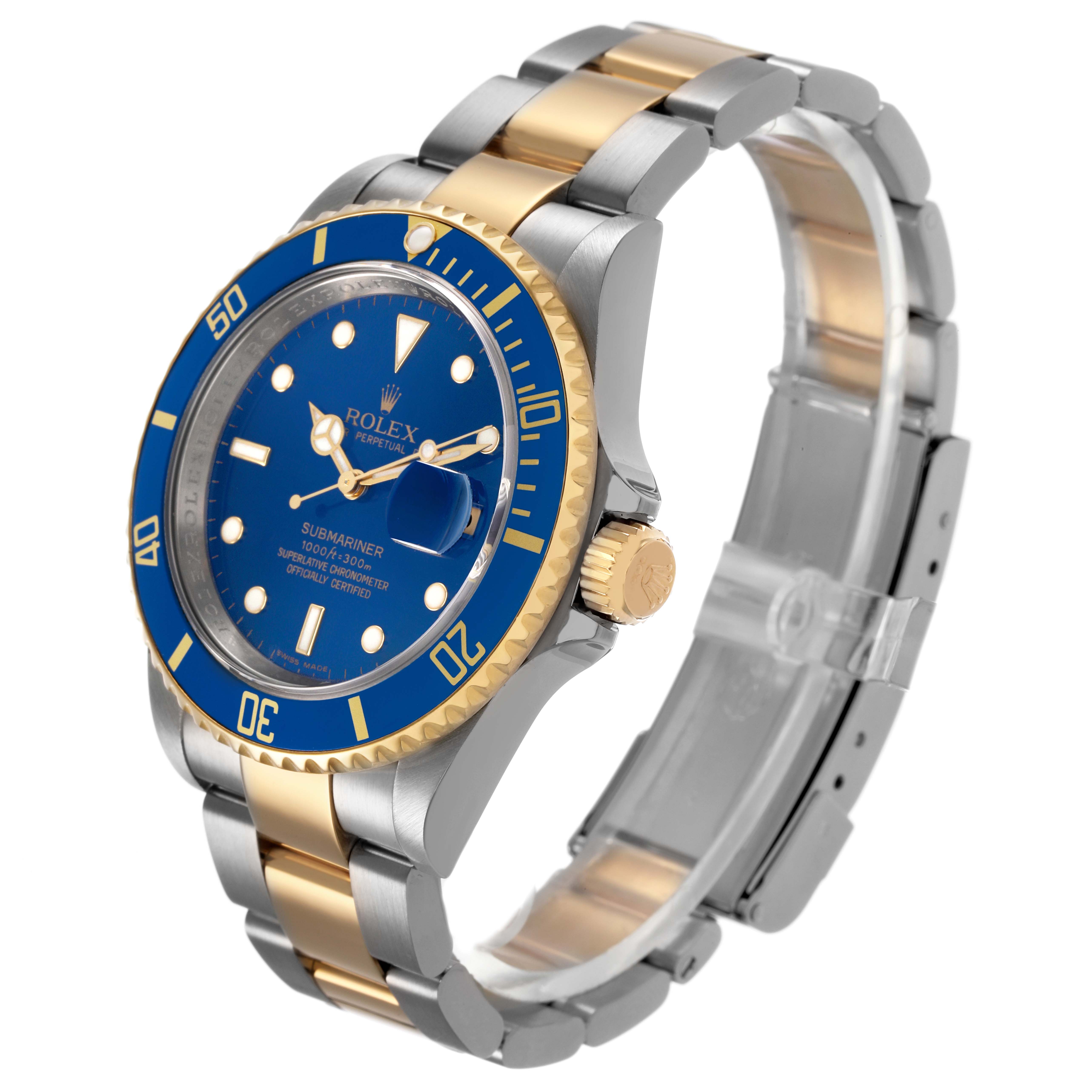 The Rolex Submariner 16613 Men's Steel and Gold (two tone) Blue Dial watch is shown at an angle highlighting the blue dial, gold and silver bracelet, bezel, and winding crown.