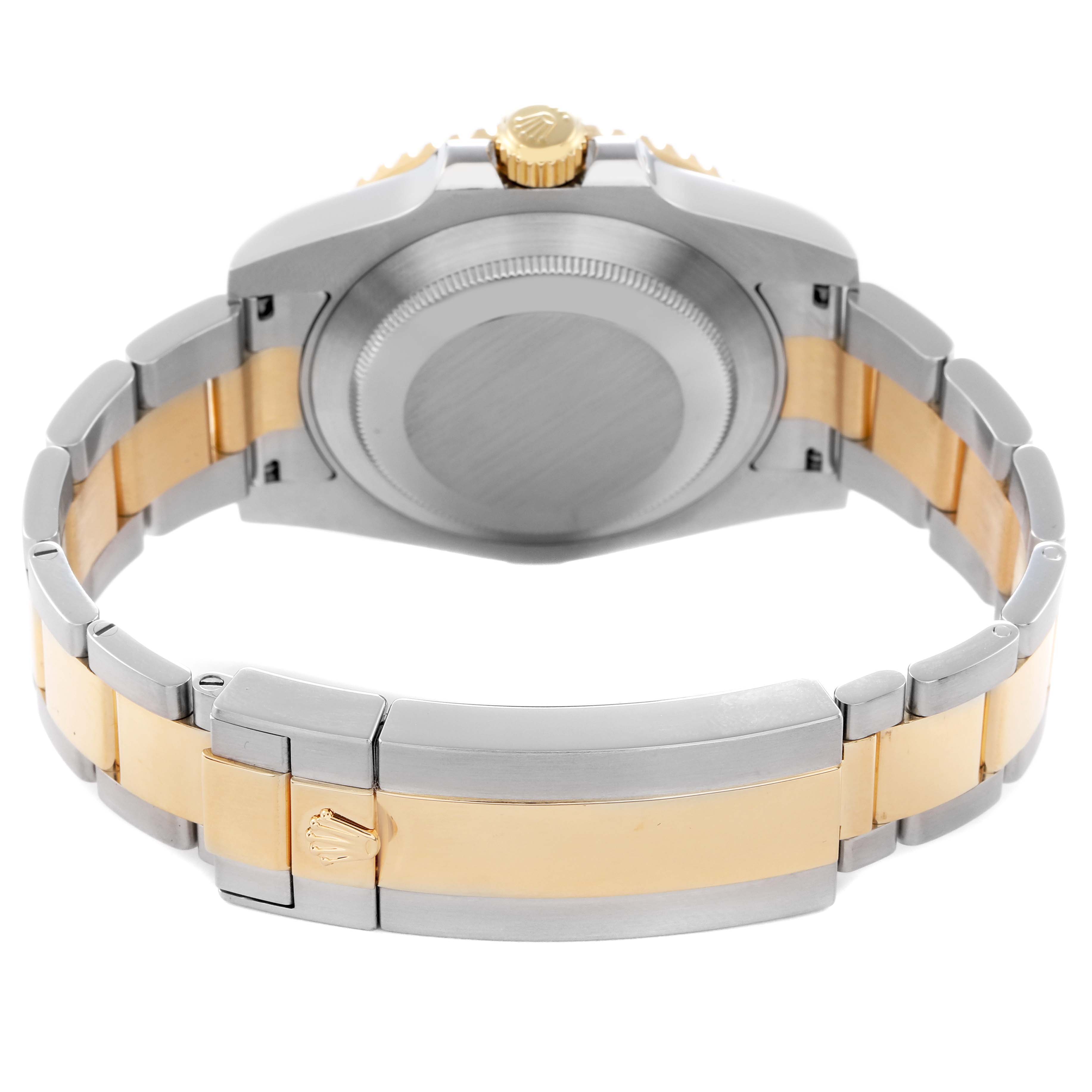 The Rolex Submariner 116613 Men
s Steel and Gold (two tone) Black Dial 116613 Men
s Steel and Gold (two tone) Black Dial watch is shown from the back angle, displaying the case back and the two-tone bracelet with the Rolex crown on the clasp.