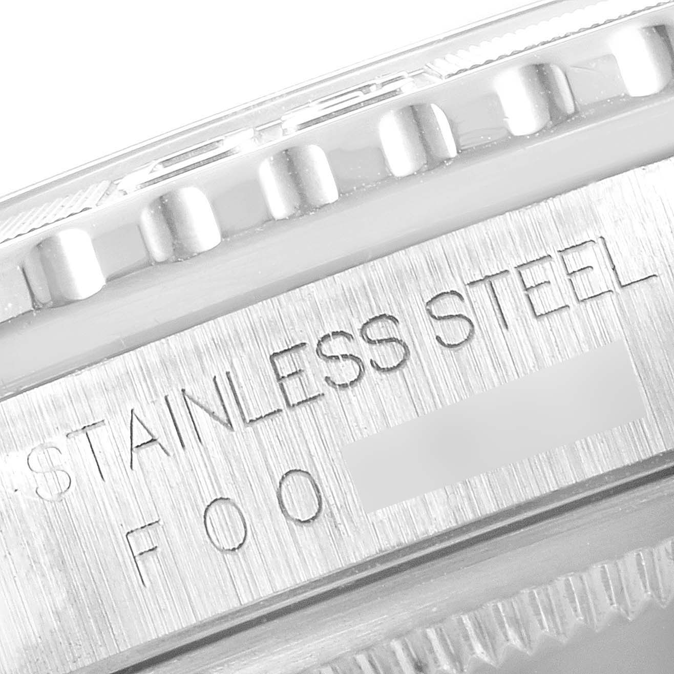 The image shows a close-up of the stainless steel bezel back case of a Rolex Turn-o-Graph 16264 Men
s Stainless Steel White Dial 16264 Men
s Stainless Steel White Dial watch.