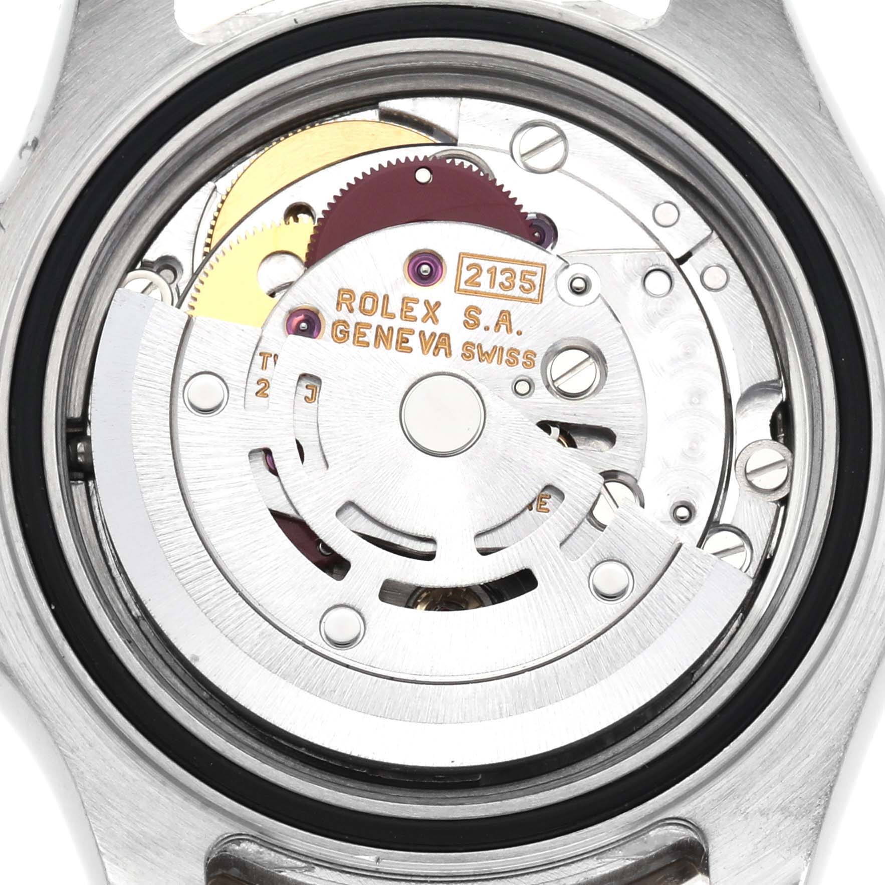 The image shows the movement of a Rolex Yacht-Master 69623 Women
s Steel and Gold (two tone) White Dial 69623 Women
s Steel and Gold (two tone) White Dial watch from a rear angle, highlighting the intricate internal components.