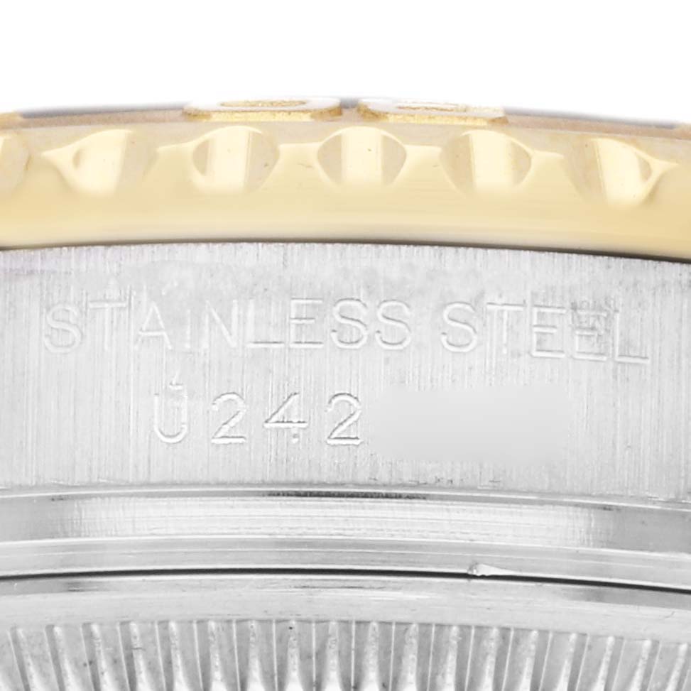 The image shows a close-up detail of the Rolex Yacht-Master 69623 Women
s Steel and Gold (two tone) White Dial 69623 Women
s Steel and Gold (two tone) White Dial, featuring the stainless steel case side with serial engraving.