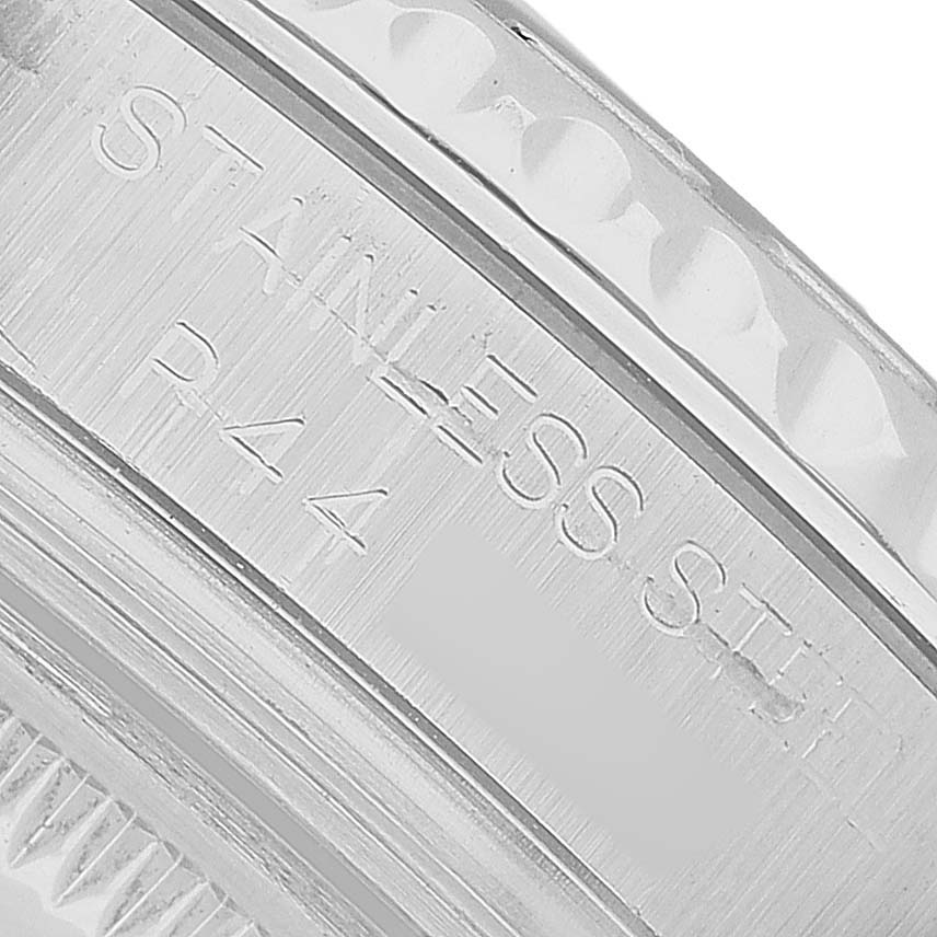The image shows a close-up of the Rolex Yacht-Master 168622 Men's Stainless Steel Silver Dial's side, highlighting the engraved "STAINLESS STEEL" marking.