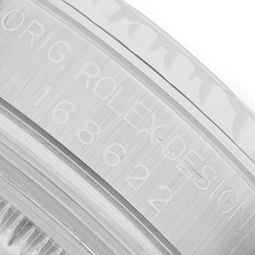 The image shows a close-up of the engraved serial number on the side of a Rolex Yacht-Master 168622 Men's Stainless Steel Silver Dial case.