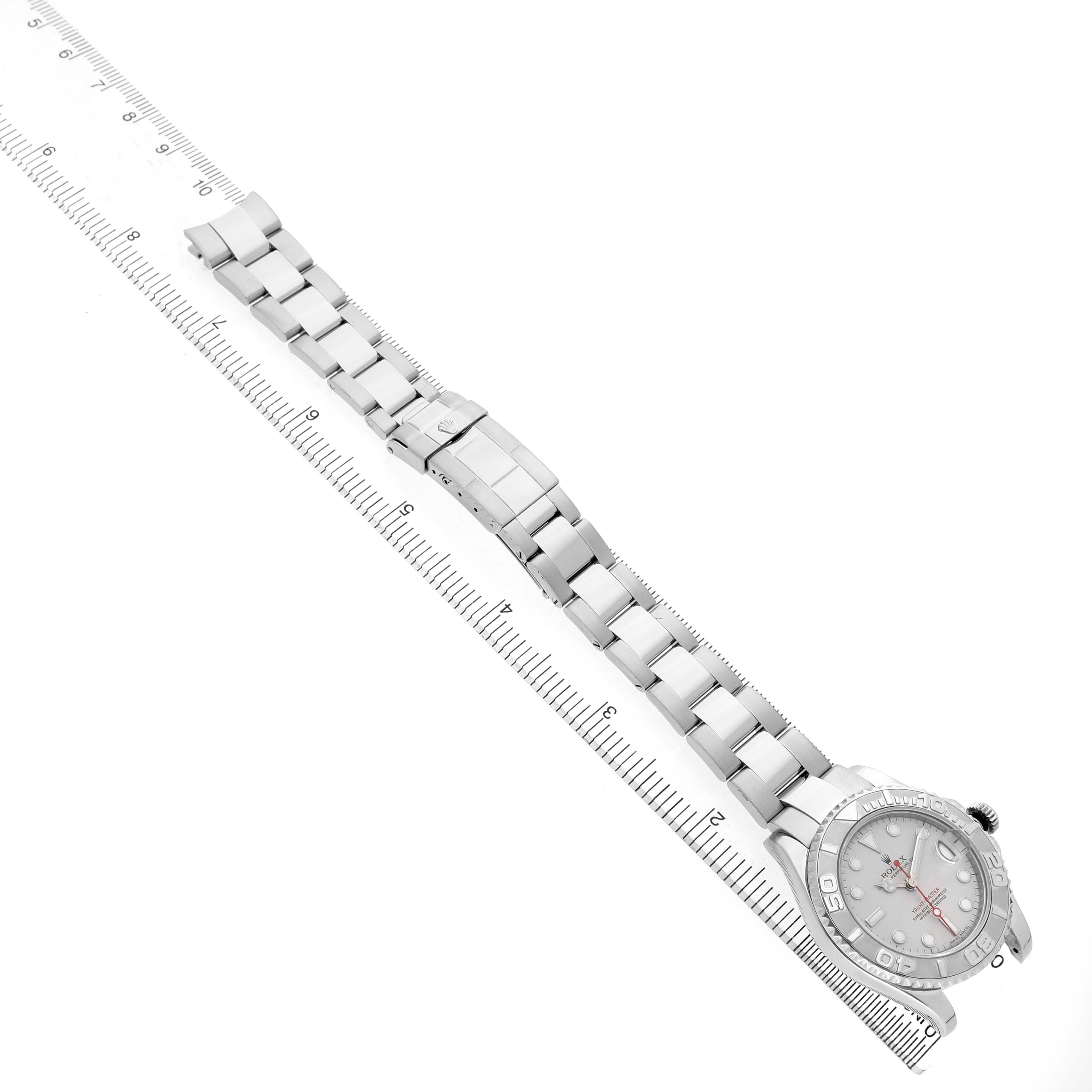 The Rolex Yacht-Master 168622 Men's Stainless Steel Silver Dial watch is shown diagonally with its full face and metal bracelet visible alongside a ruler for scale.