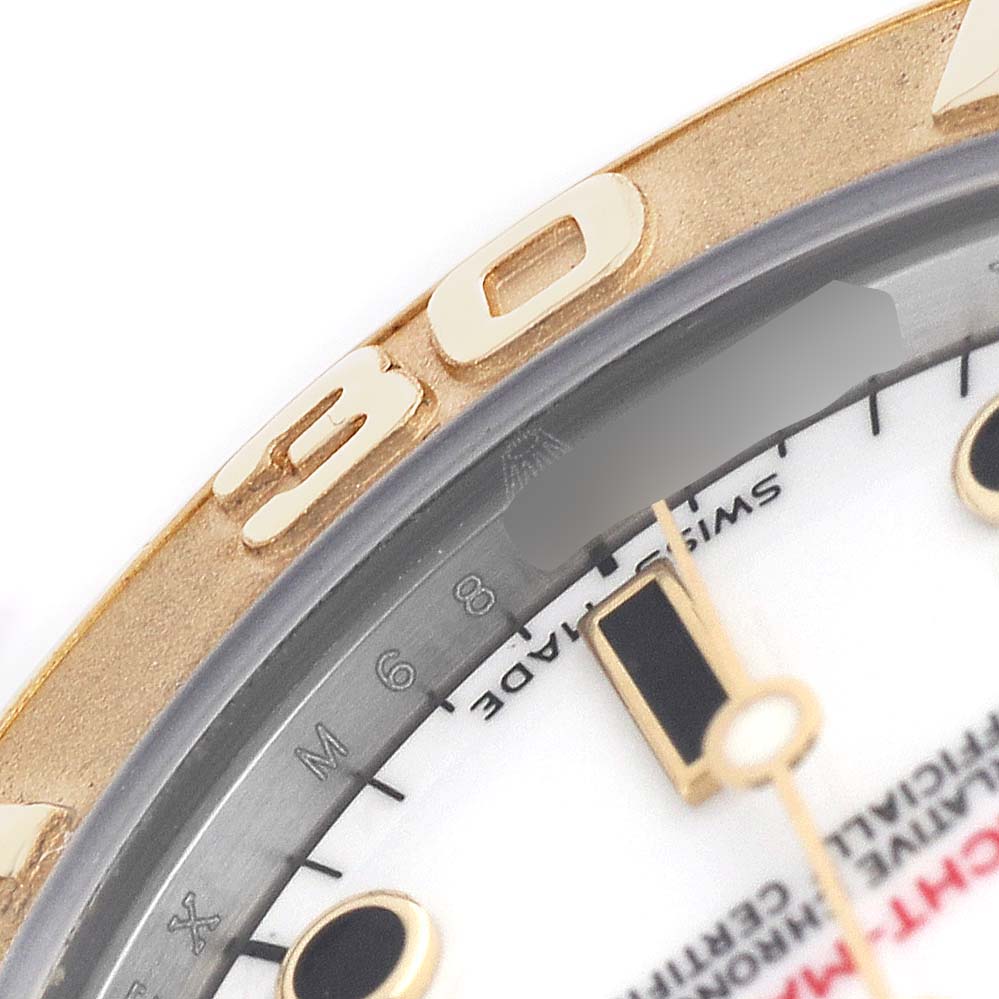 The image shows a close-up of the Rolex Yacht-Master 168623 Men's Steel and Gold (two tone) White Dial watch bezel, dial, and part of the minute hand.