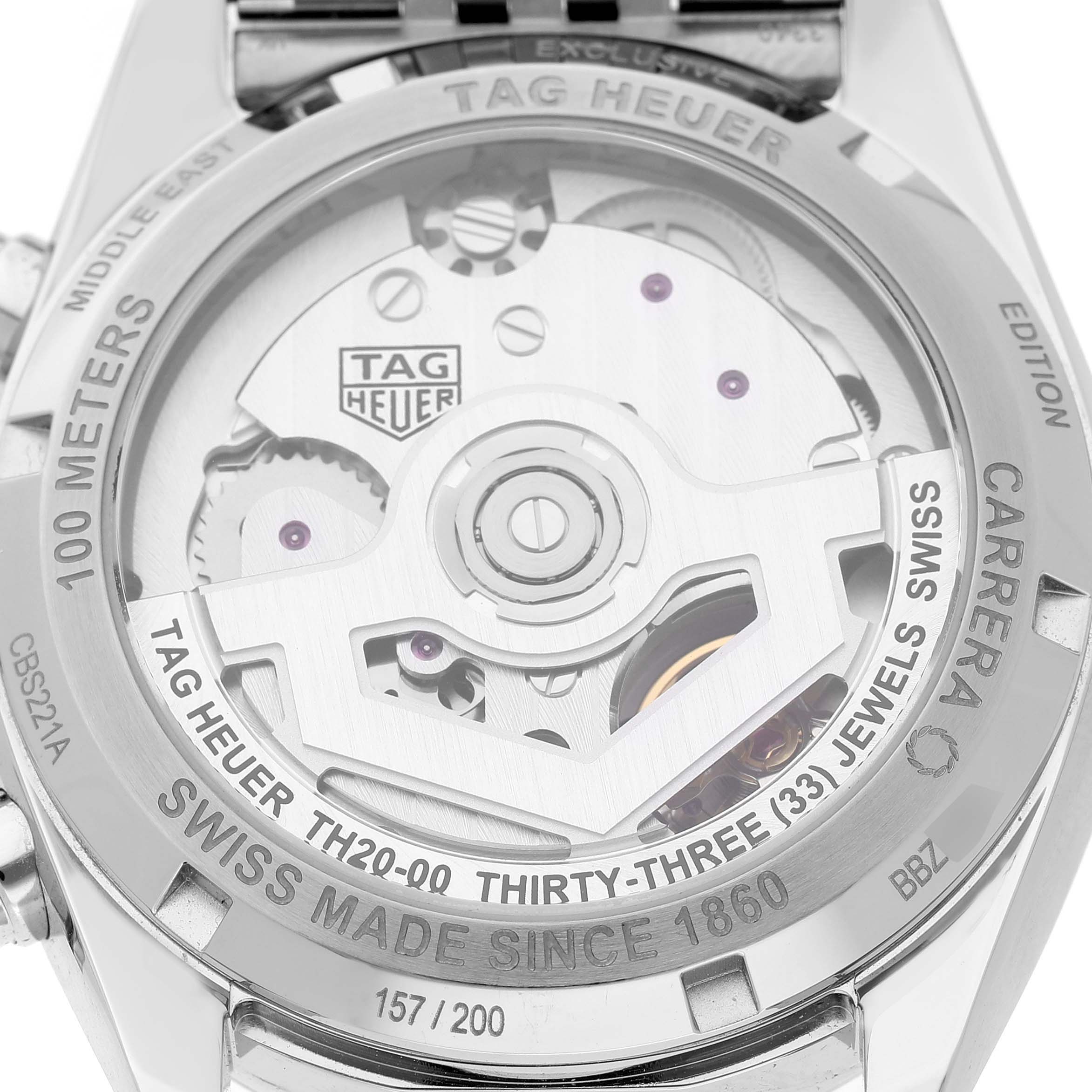 The image shows the back view of a Tag Heuer Carrera CBS221A Men's Stainless Steel Green Dial, highlighting its movement and engraved details.