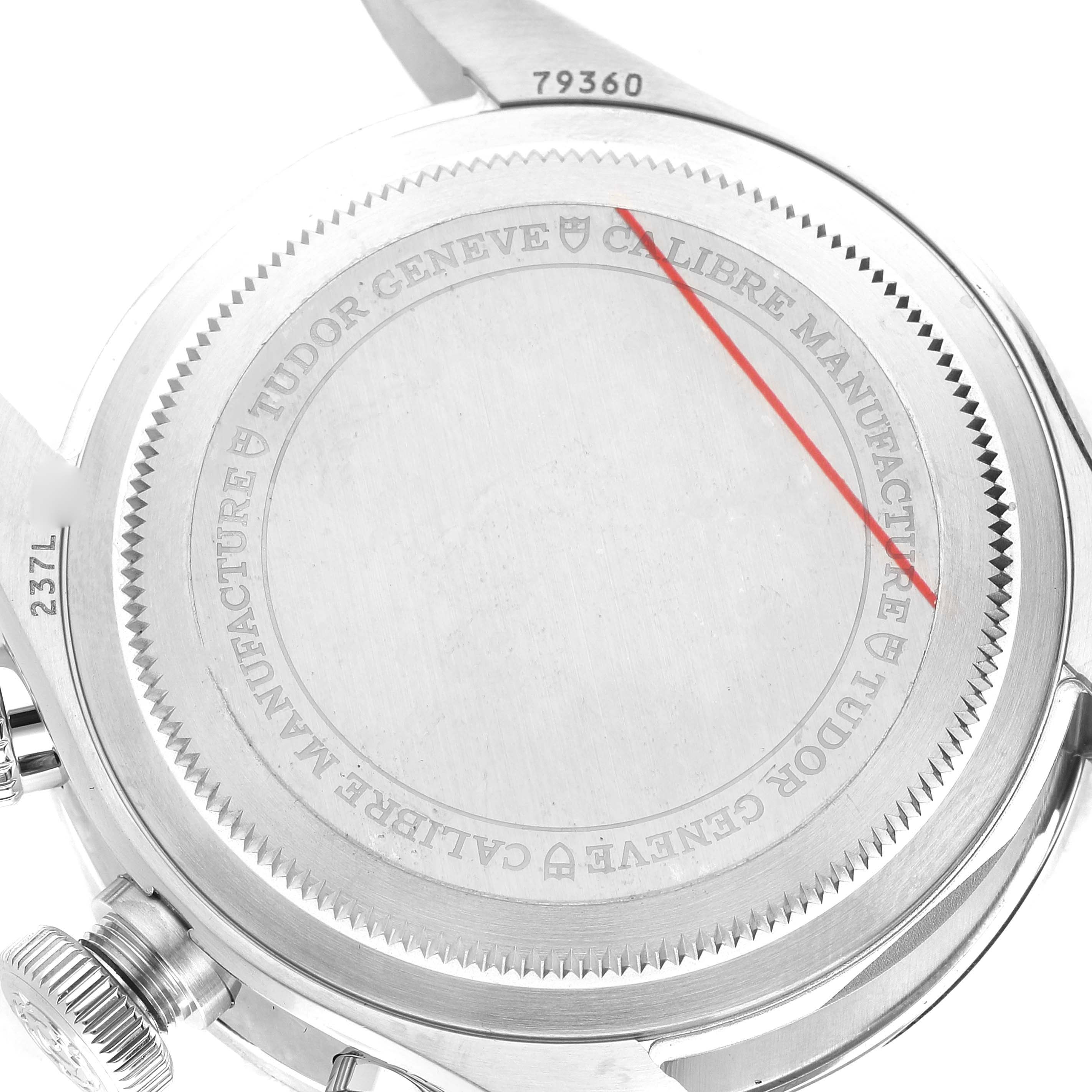 The image shows the back casing of the Tudor Heritage Chrono 79360N Men's Stainless Steel Black Dial 79360N Men's Stainless Steel Black Dial watch, highlighting its engraving and serial numbers.