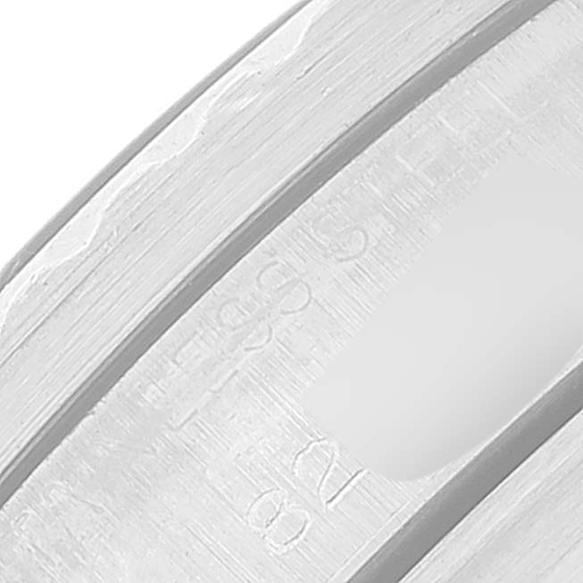 This close-up image shows a partial view of the case back and engravings of a Tudor Submariner 7016 Men
s Stainless Steel Black Dial 7016 Men
s Stainless Steel Black Dial watch.