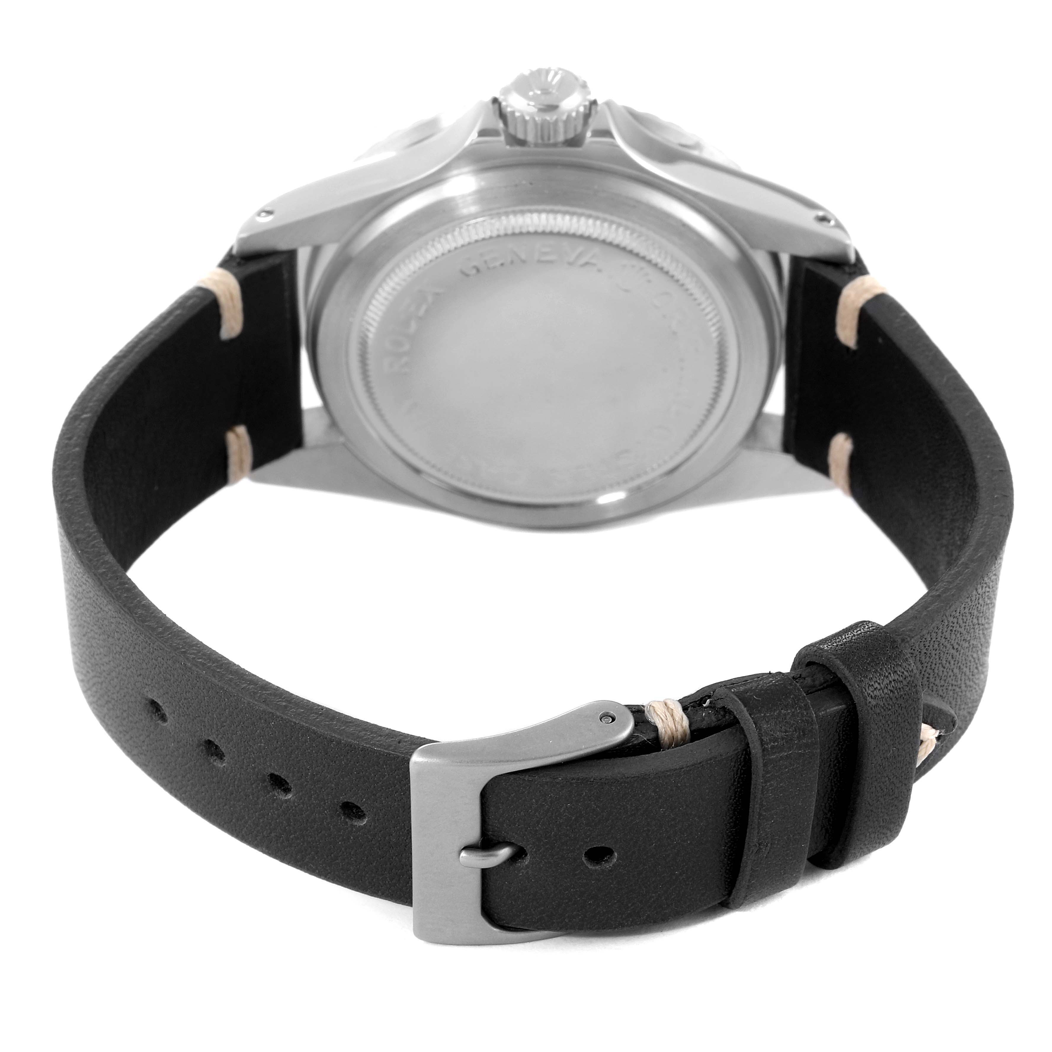 The image shows the rear view of a Tudor Submariner 7016 Men
s Stainless Steel Black Dial 7016 Men
s Stainless Steel Black Dial watch, highlighting its case back and black leather strap with a buckle.