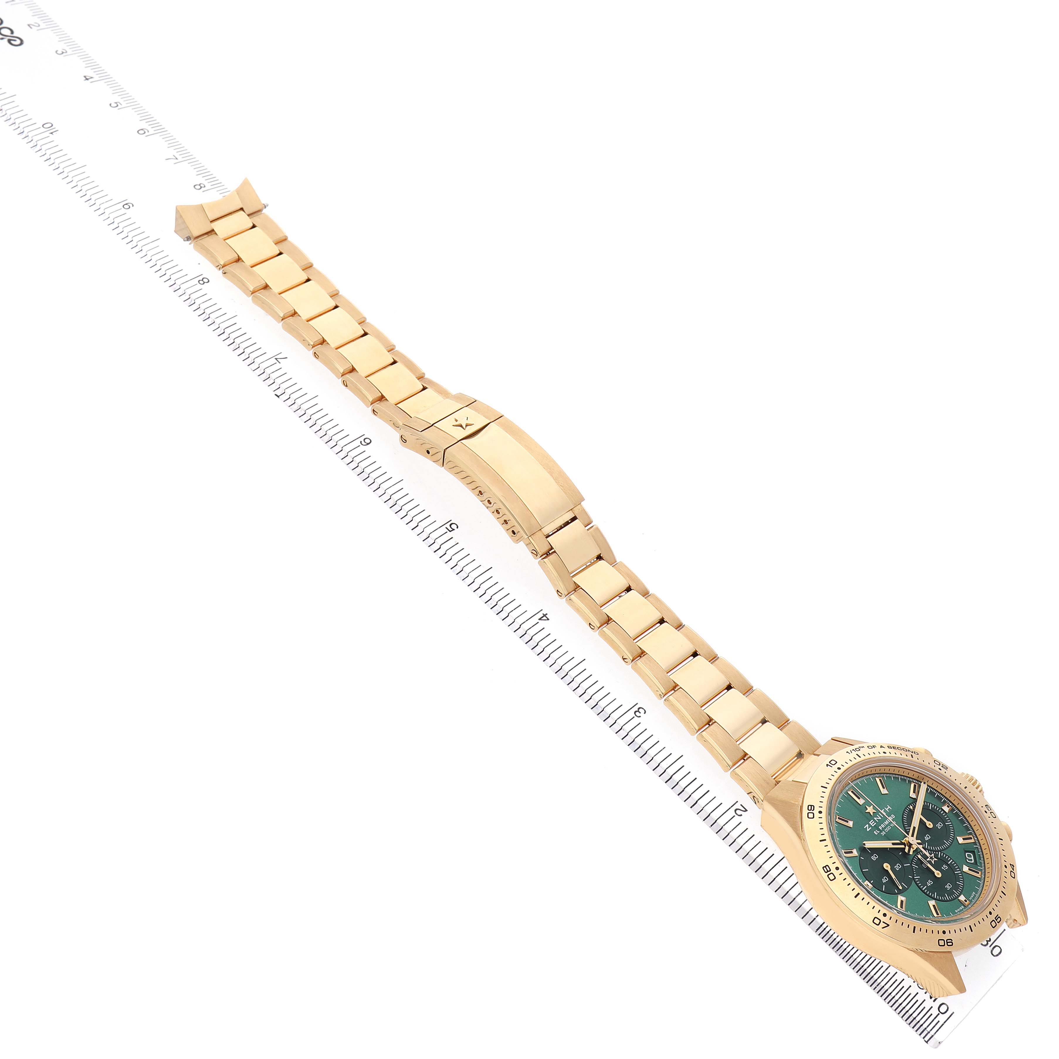 The Zenith Chronomaster 30.3100.3600 Men's Yellow Gold Green Dial watch is shown diagonally, featuring the full bracelet and clasp with a green dial.
