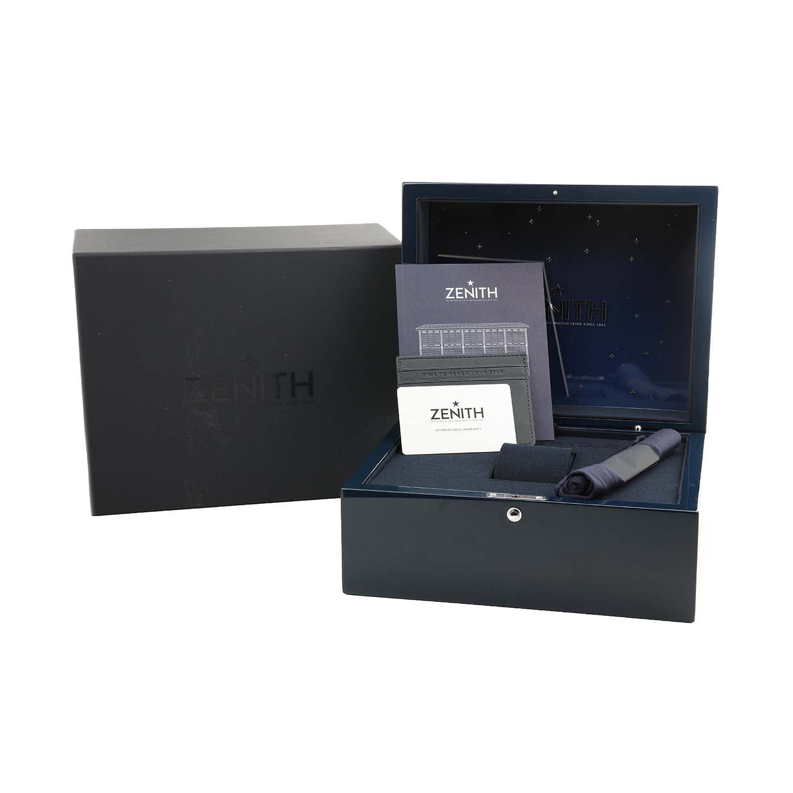 The image shows the Zenith Chronomaster 30.3100.3600 Men's Yellow Gold Green Dial watch packaging, including a box, documents, and a cloth, viewed from the front.