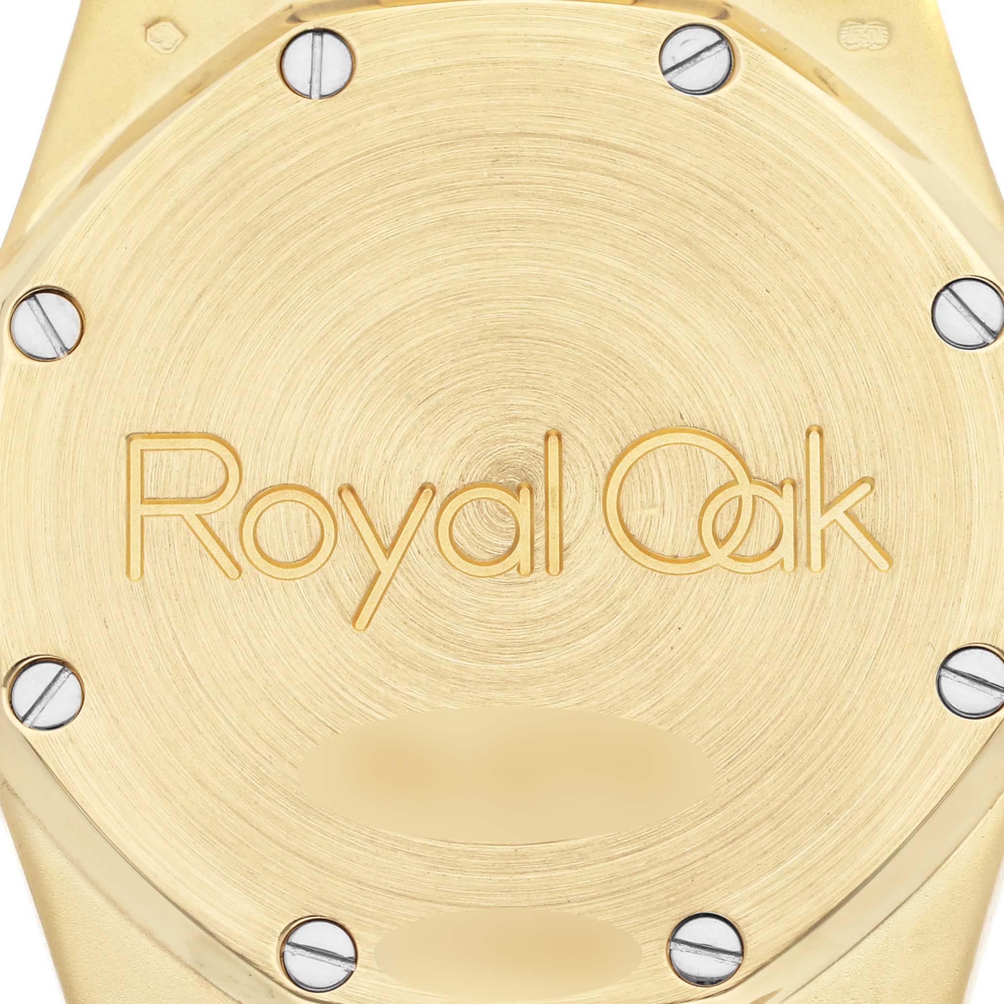 The image shows the back case of an Audemars Piguet Royal Oak 15000BA.OO.0789BA.04 Men's Yellow Gold Champagne Dial 15000BA.OO.0789BA.04 Men's Yellow Gold Champagne Dial watch, featuring engraved branding and visible screws.