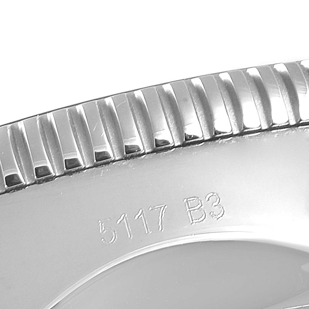 This image shows a close-up of the bezel and engraved serial number on a Breitling Superocean AB2010161C1A1 Men's Stainless Steel Blue Dial AB2010161C1A1 Men's Stainless Steel Blue Dial watch.