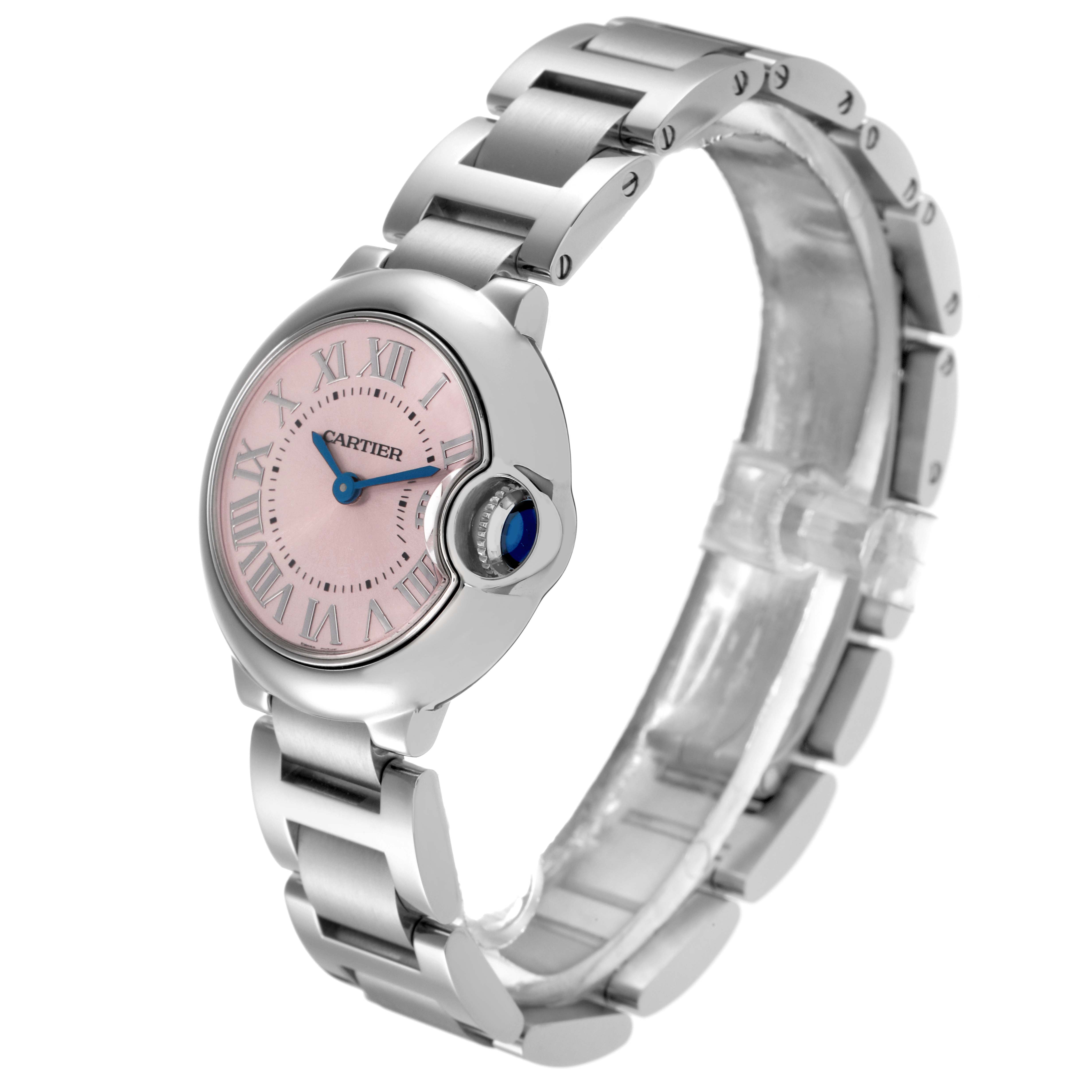 The image shows a Cartier Ballon Bleu 72027 Women
s Stainless Steel Pink Dial 72027 Women
s Stainless Steel Pink Dial watch at a three-quarter angle, highlighting the pink dial, blue hands, crown, and metal bracelet.