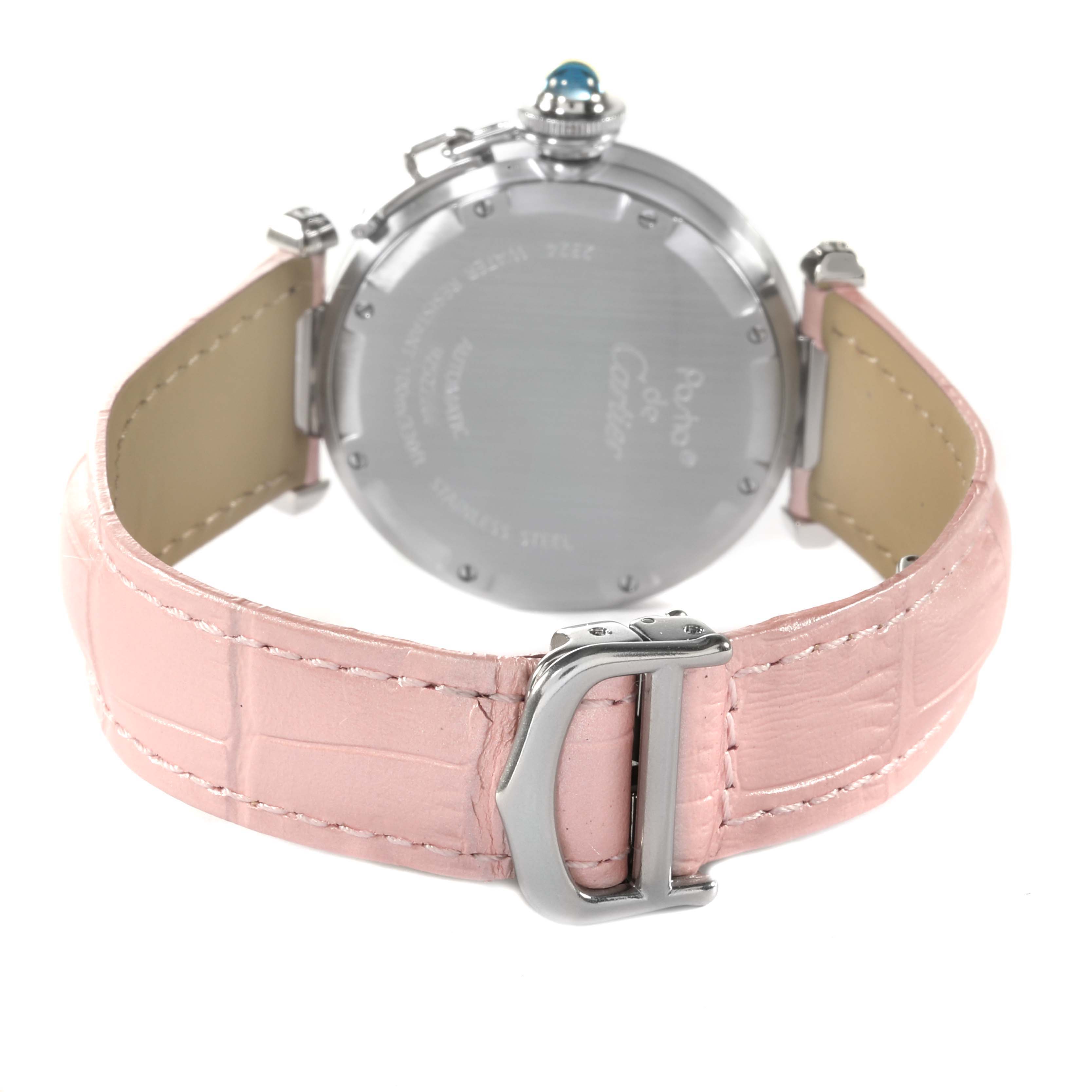 The image shows the back view of a Cartier Pasha 61675 Women's Stainless Steel Pink Dial 61675 Women's Stainless Steel Pink Dial watch, focusing on the case back, crown, and pink leather strap with a buckle.