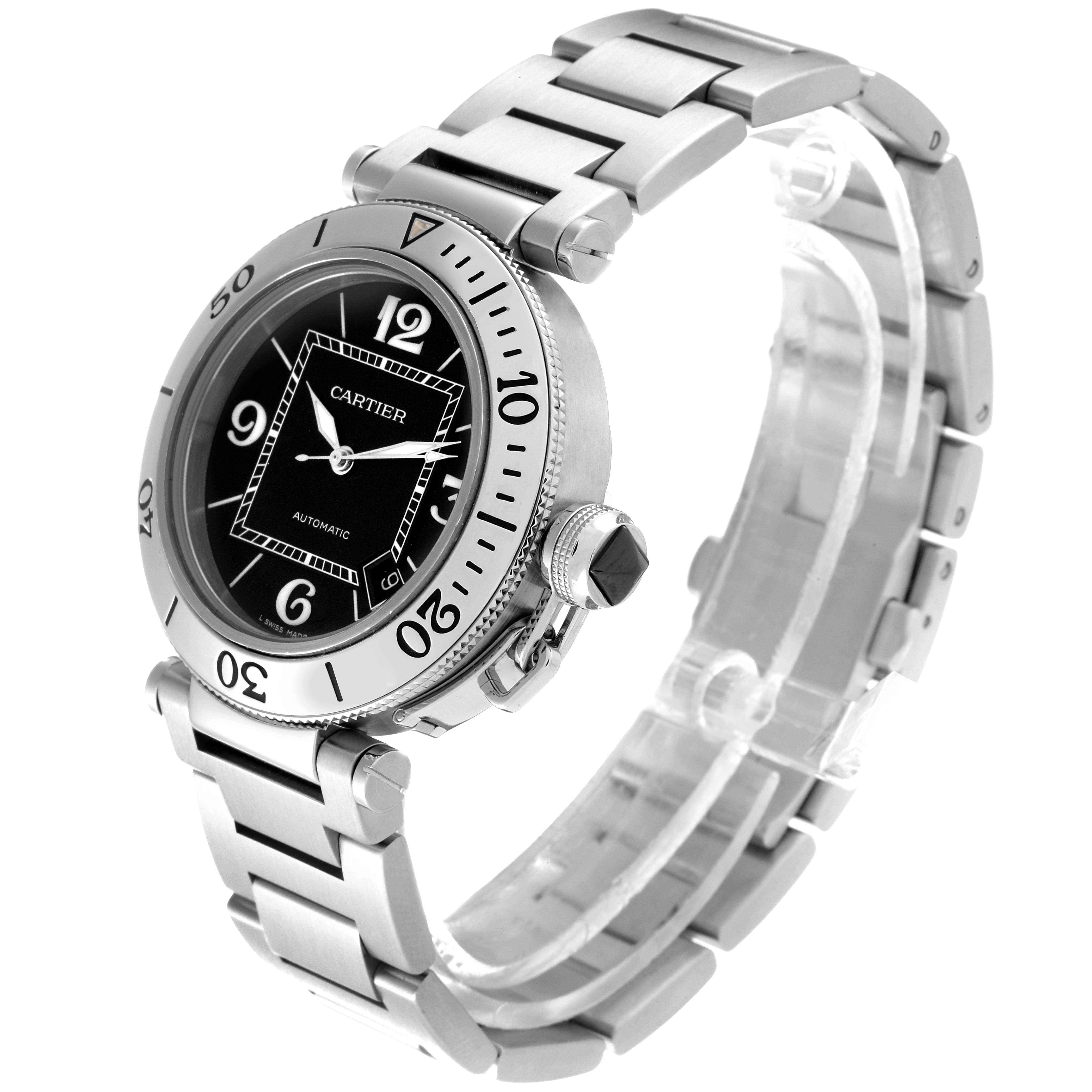 The image shows a Cartier Pasha W31077M7 Men
s Stainless Steel Black Dial W31077M7 Men
s Stainless Steel Black Dial watch at an angle, highlighting its face, bezel, and stainless steel bracelet.