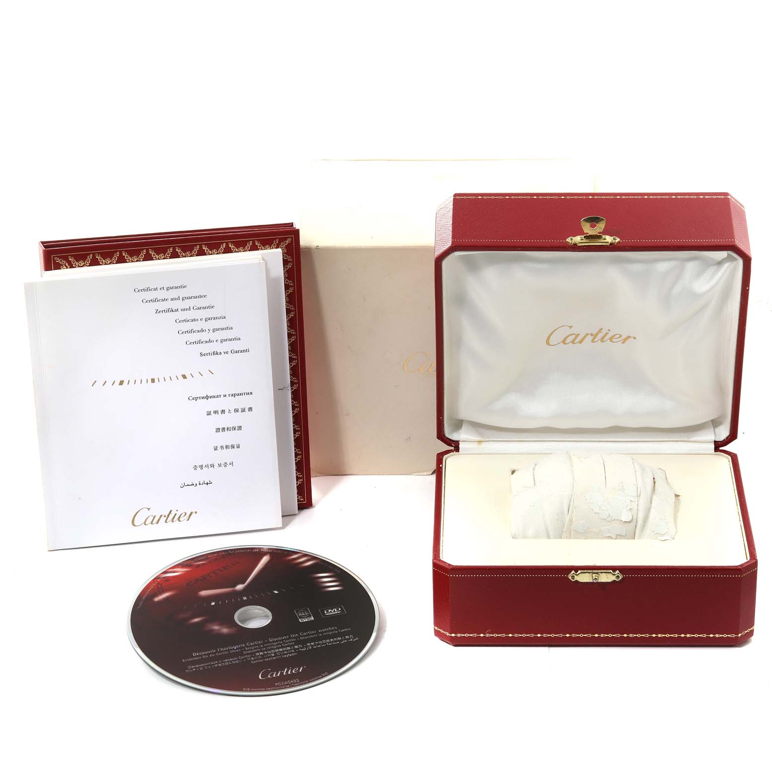 The image shows the Cartier Pasha W31077M7 Men
s Stainless Steel Black Dial W31077M7 Men
s Stainless Steel Black Dial watch box, warranty booklets, and a DVD from a slightly elevated front angle.