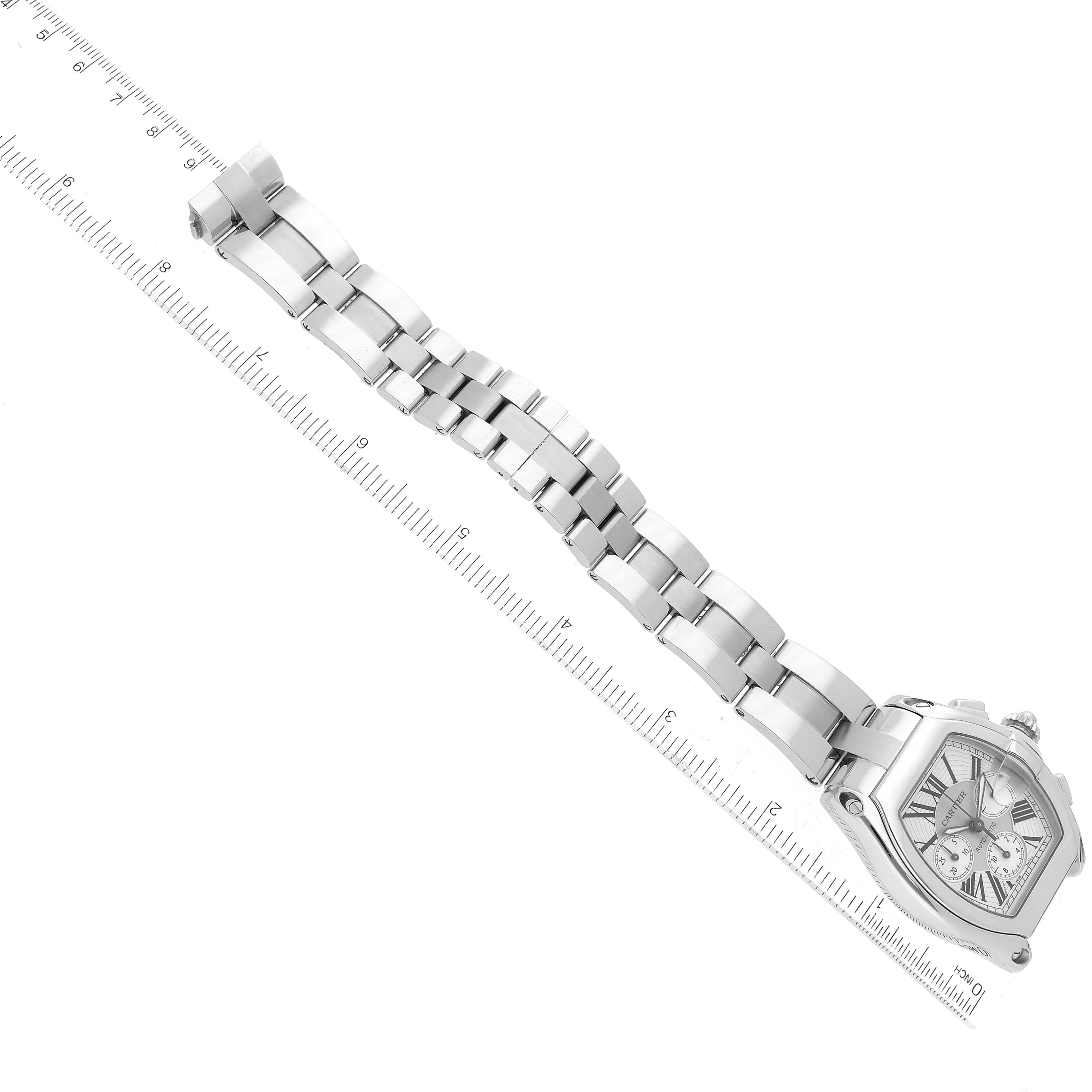 The image shows a Cartier Roadster W62019X6 Men's Stainless Steel Silver Dial W62019X6 Men's Stainless Steel Silver Dial watch laid flat, angled to display its linked metal bracelet and face.