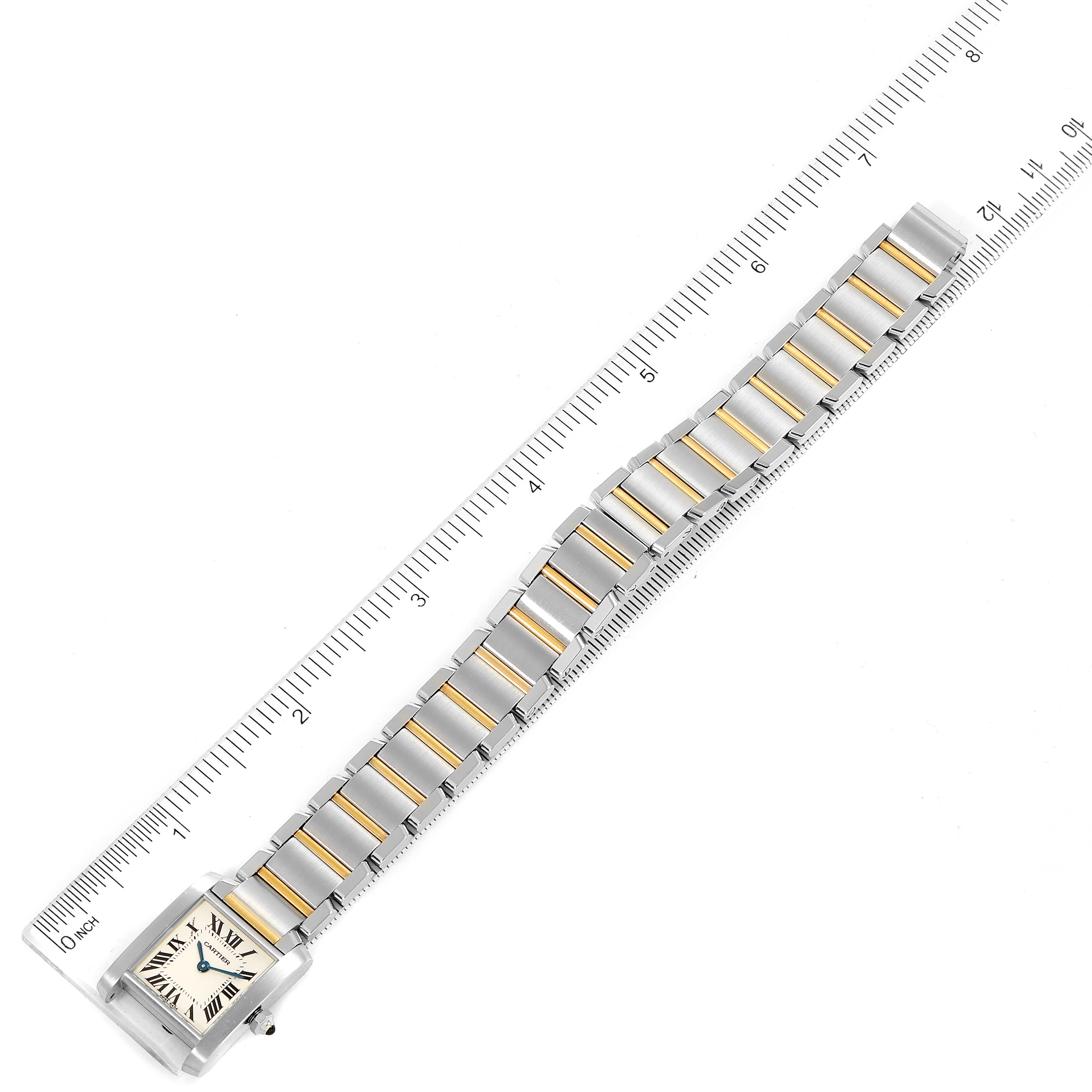 The image shows a Tank Francaise watch by Cartier, including its full face, bracelet, and clasp, seen from an overhead angle.