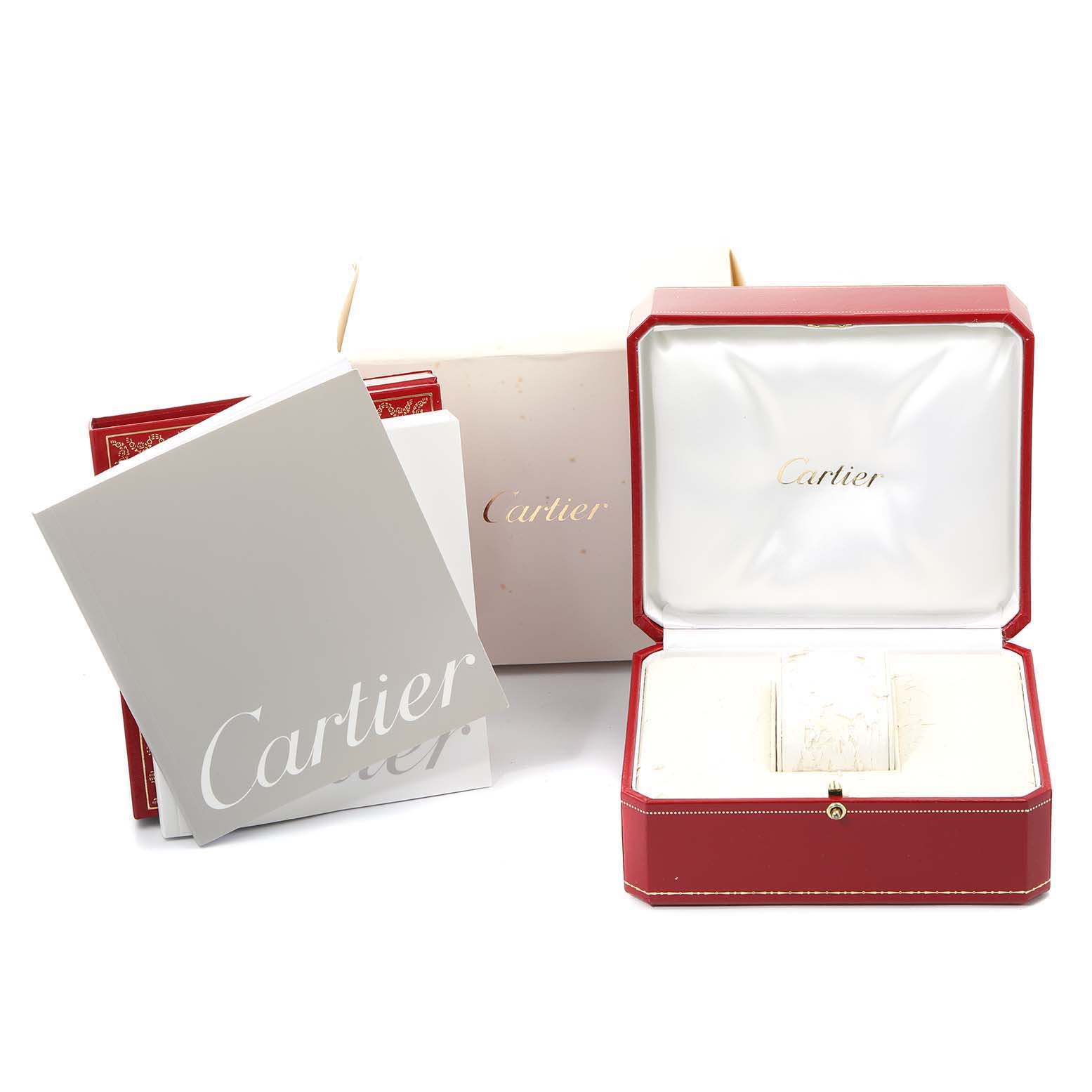 The image shows the packaging accessories for the Cartier Tank Francaise W51007Q4 Women's Steel and Gold (two tone) Silver Dial W51007Q4 Women's Steel and Gold (two tone) Silver Dial watch, including the red box, booklet, and inner white cushion.