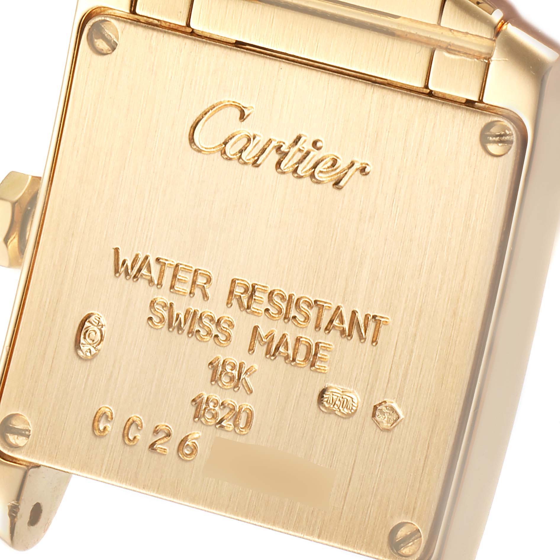 The image shows the back case of a Cartier Tank Francaise W50002N2 Women's Yellow Gold Silver Dial W50002N2 Women's Yellow Gold Silver Dial watch, displaying text and hallmark details.