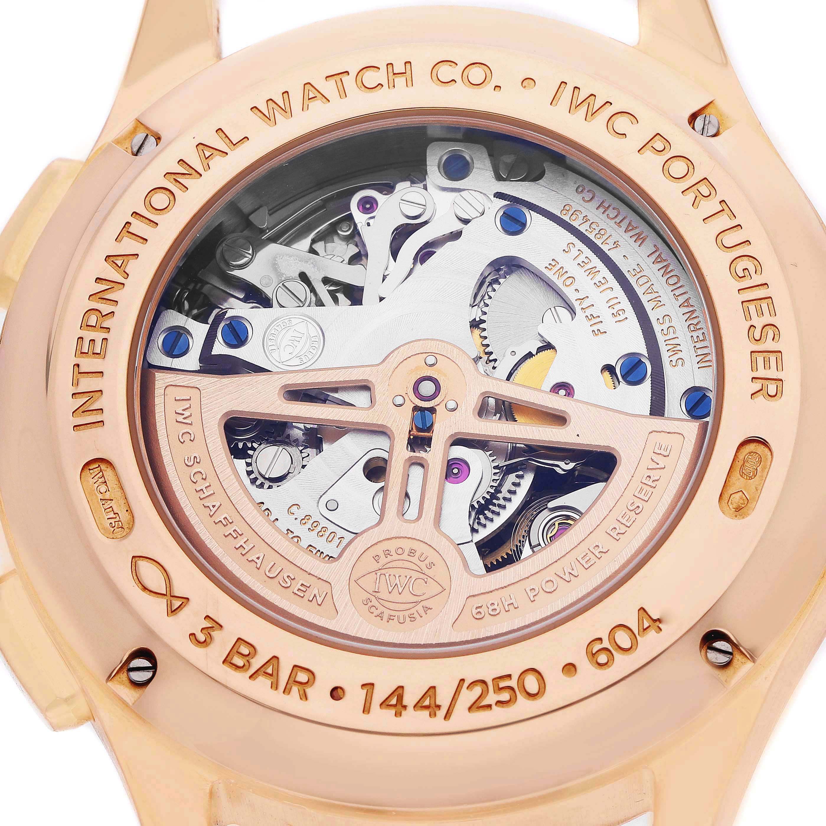 The image shows the back of an IWC Portugieser watch, highlighting its movement and engraving details.