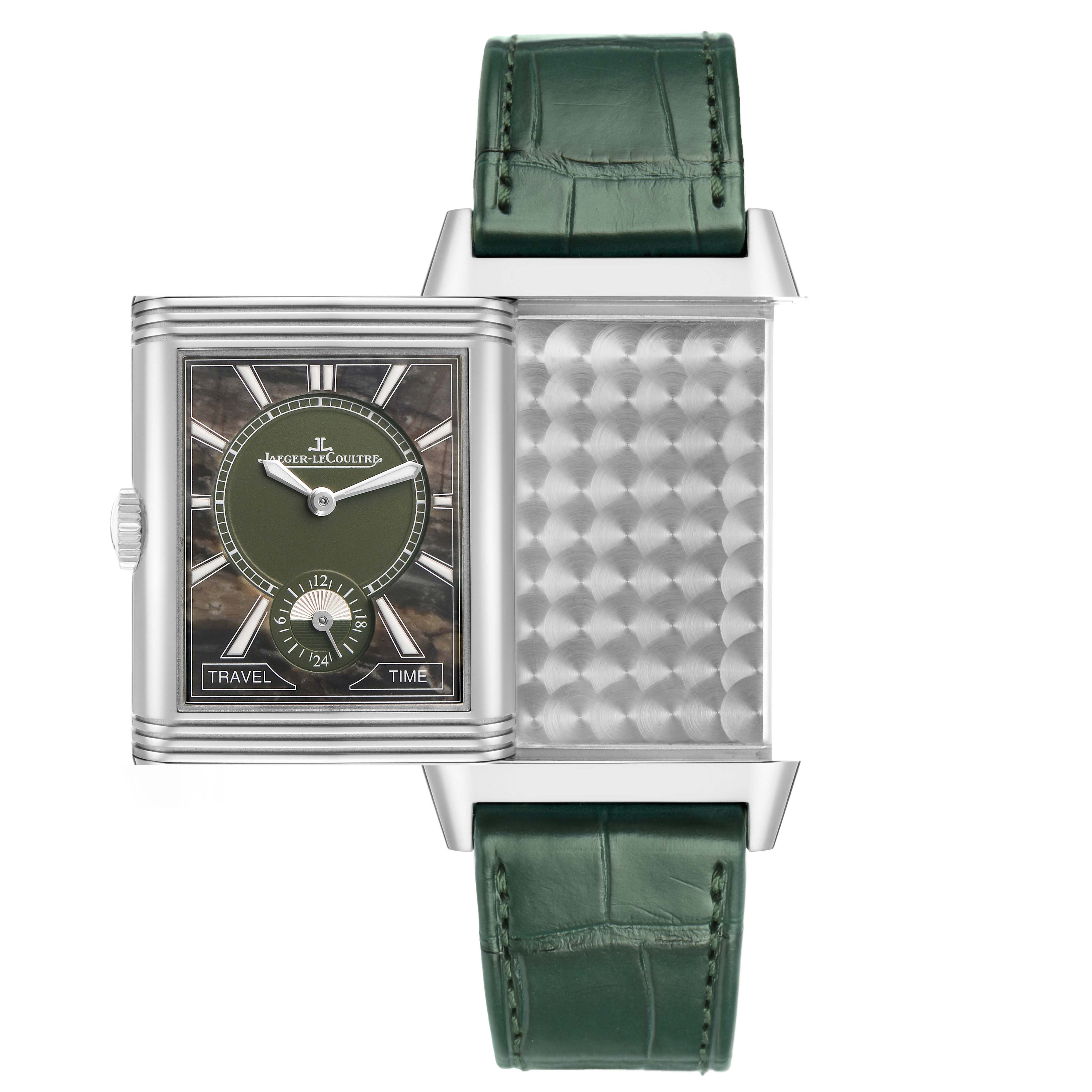 The Jaeger-LeCoultre Reverso watch is shown from the front with an open case, revealing its pattern, along with a green strap.