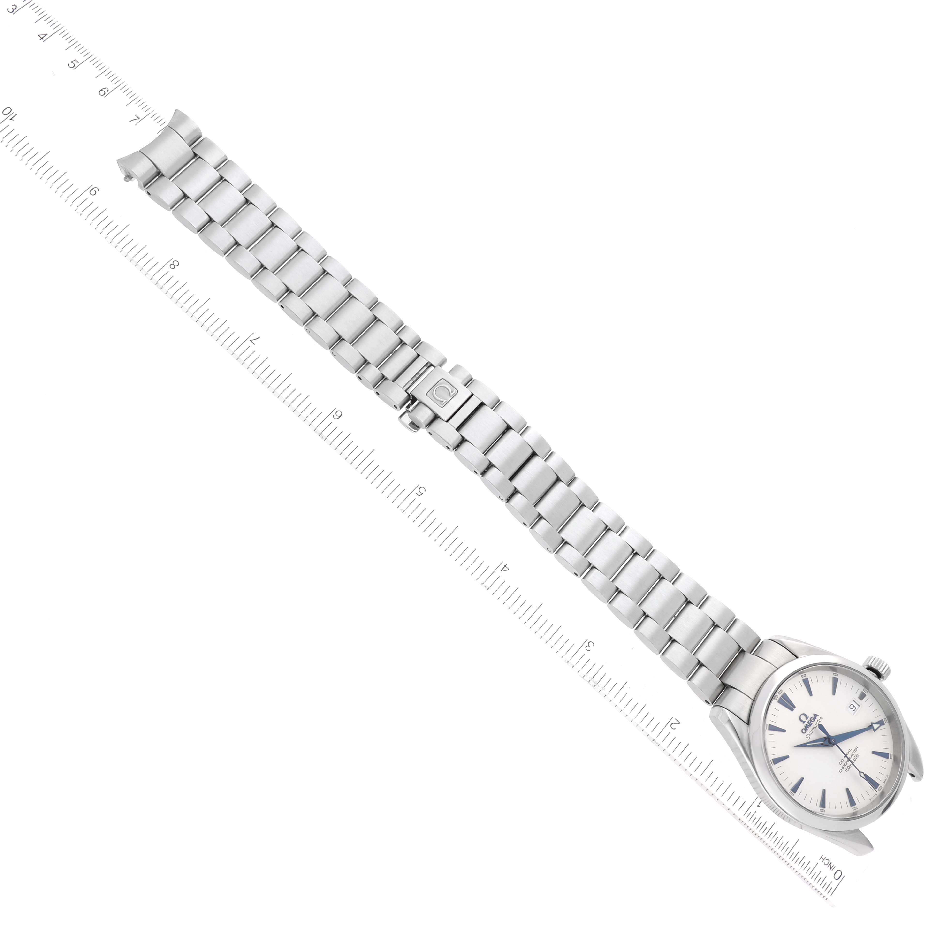 The image shows an Omega Aqua Terra 2503.33.00 Men
s Stainless Steel Silver Dial 2503.33.00 Men
s Stainless Steel Silver Dial watch laid flat with a ruler, displaying the full length of its silver metal bracelet.