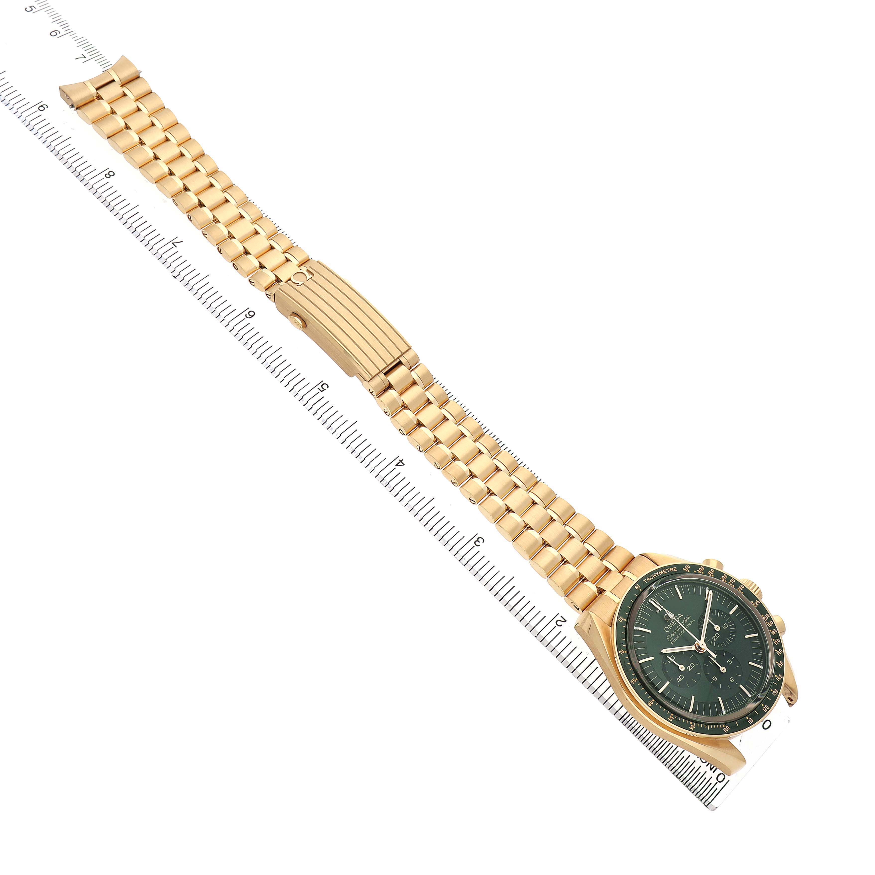 The Omega Speedmaster 310.60.42.50.10.001 Men's Yellow Gold Green Dial watch is shown from an angled top view, highlighting its gold bracelet and green dial.