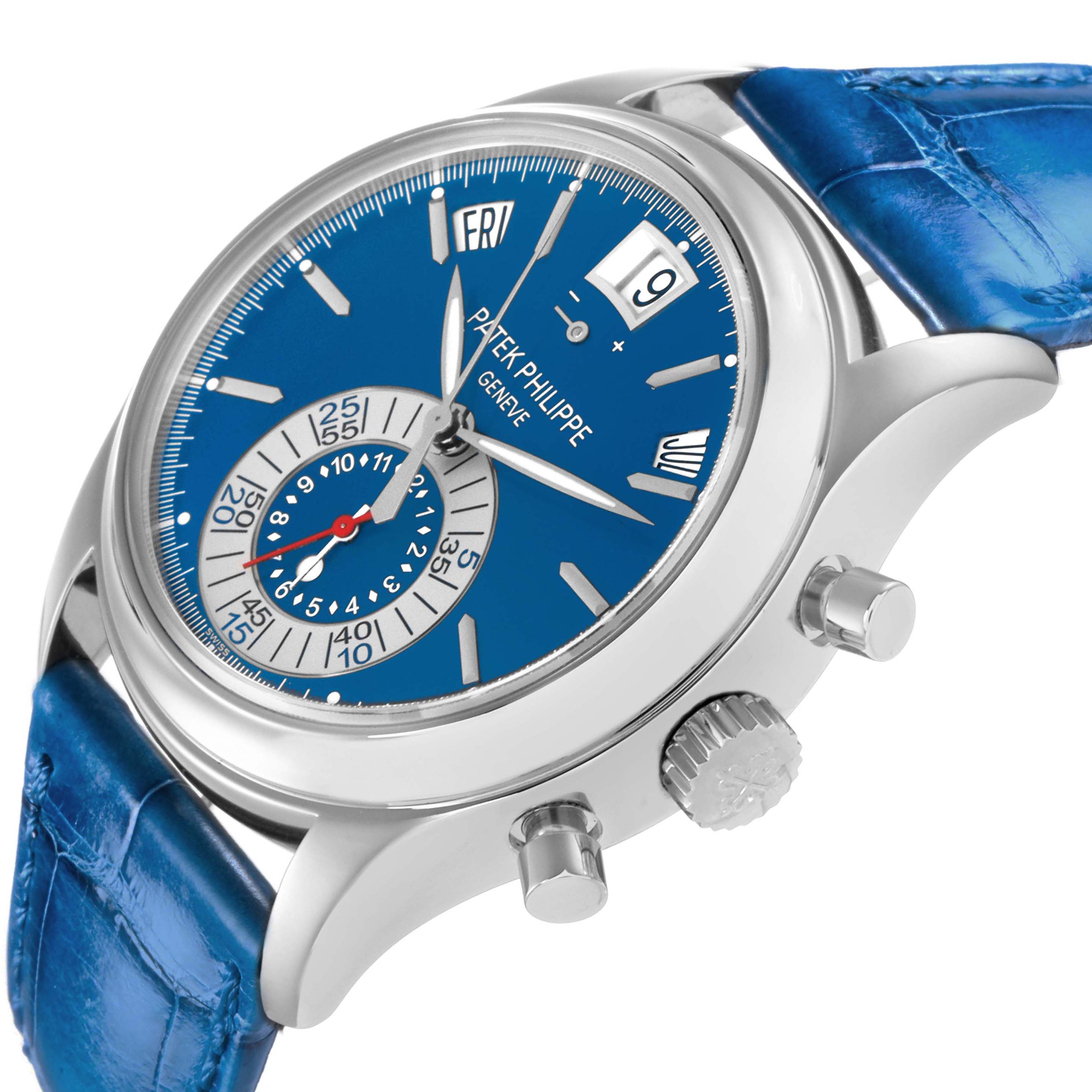 The Patek Philippe Complications 5960P-015 Men
s Platinum Blue Dial watch is shown at an angle highlighting the blue dial, side crown, and pushers, with a blue strap.
