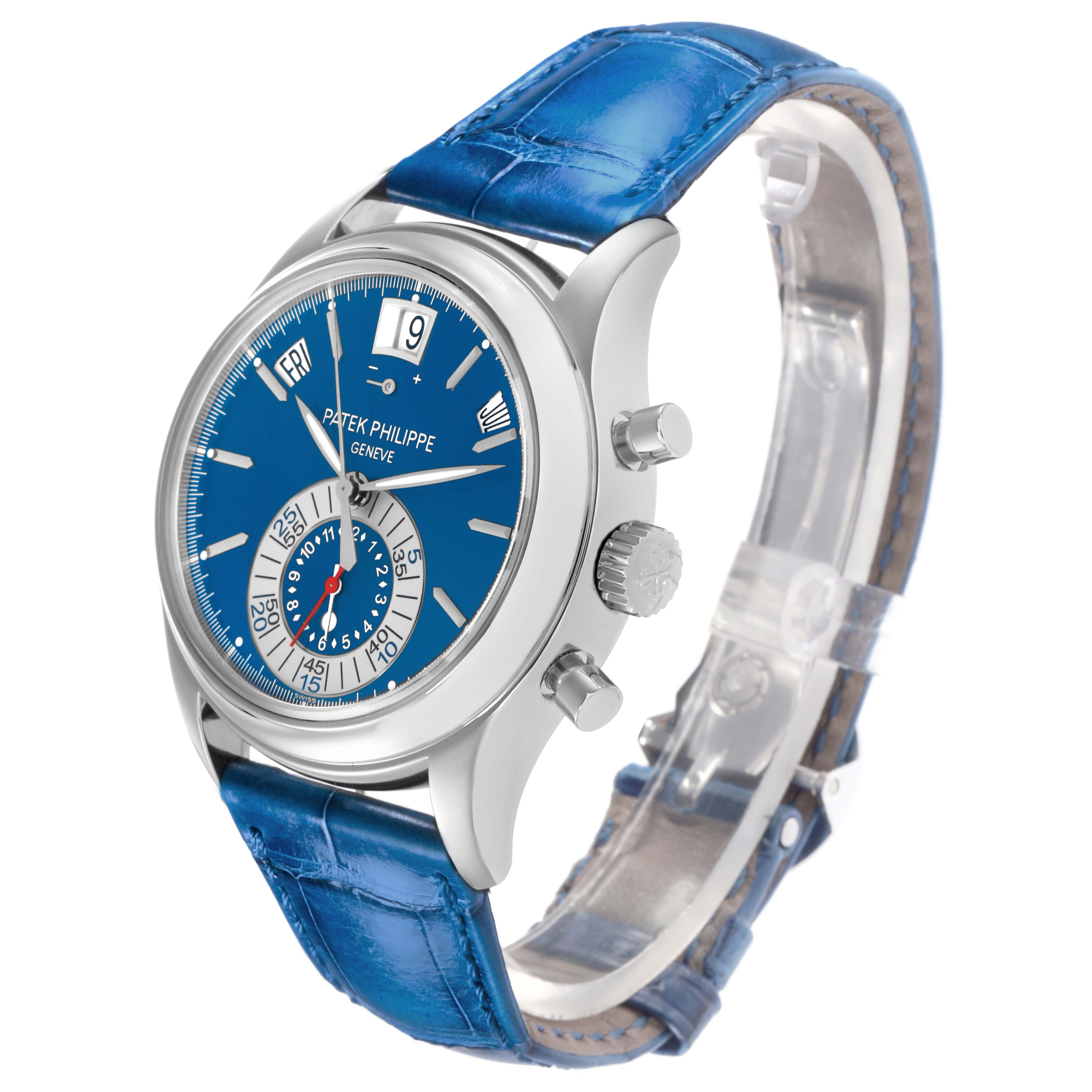 The Patek Philippe Complications 5960P-015 Men
s Platinum Blue Dial watch is shown at a three-quarter angle, highlighting the blue dial, sub-dials, leather strap, and side pushers.