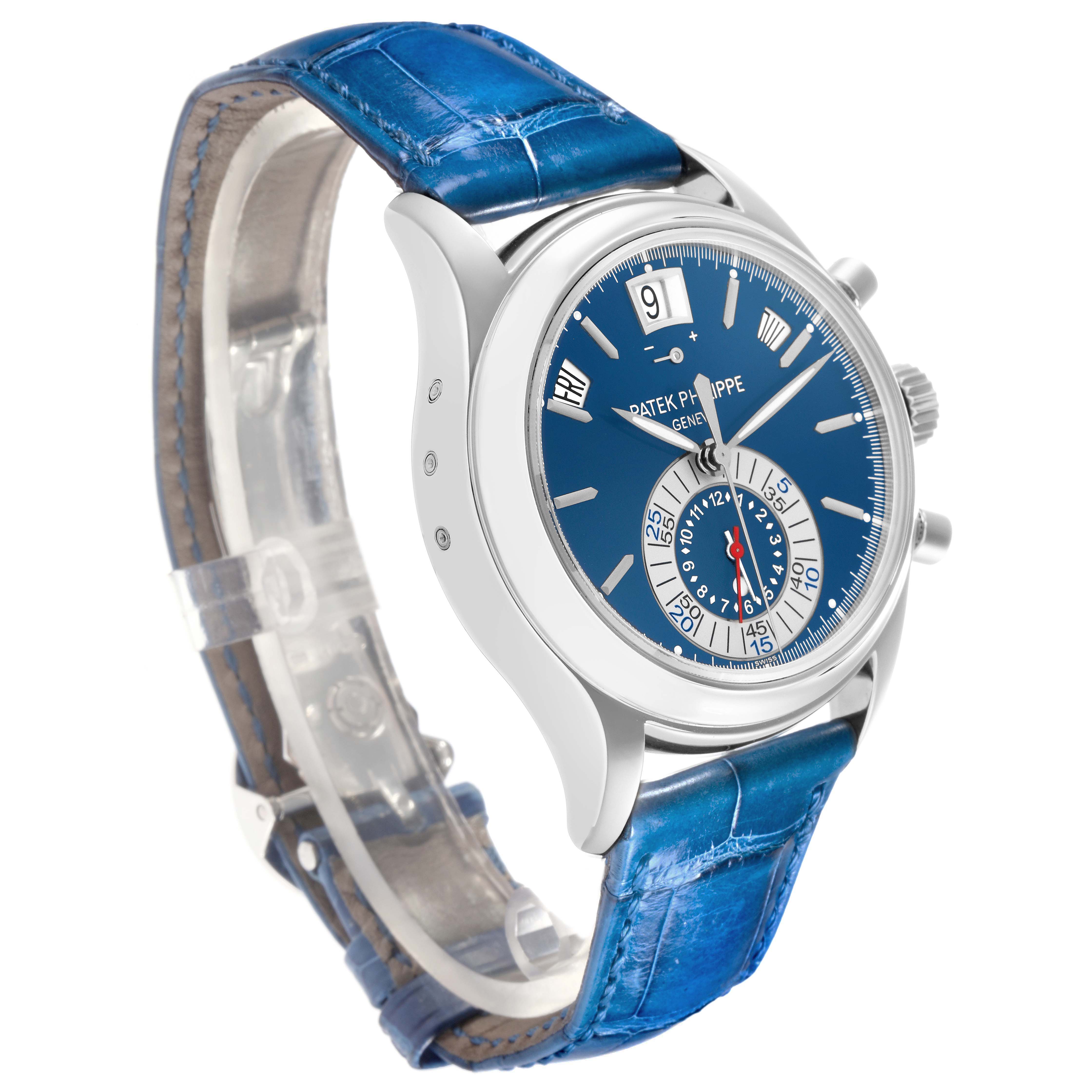 The Patek Philippe Complications 5960P-015 Men
s Platinum Blue Dial watch is shown at a side angle, highlighting the blue dial, silver case, and blue leather strap.