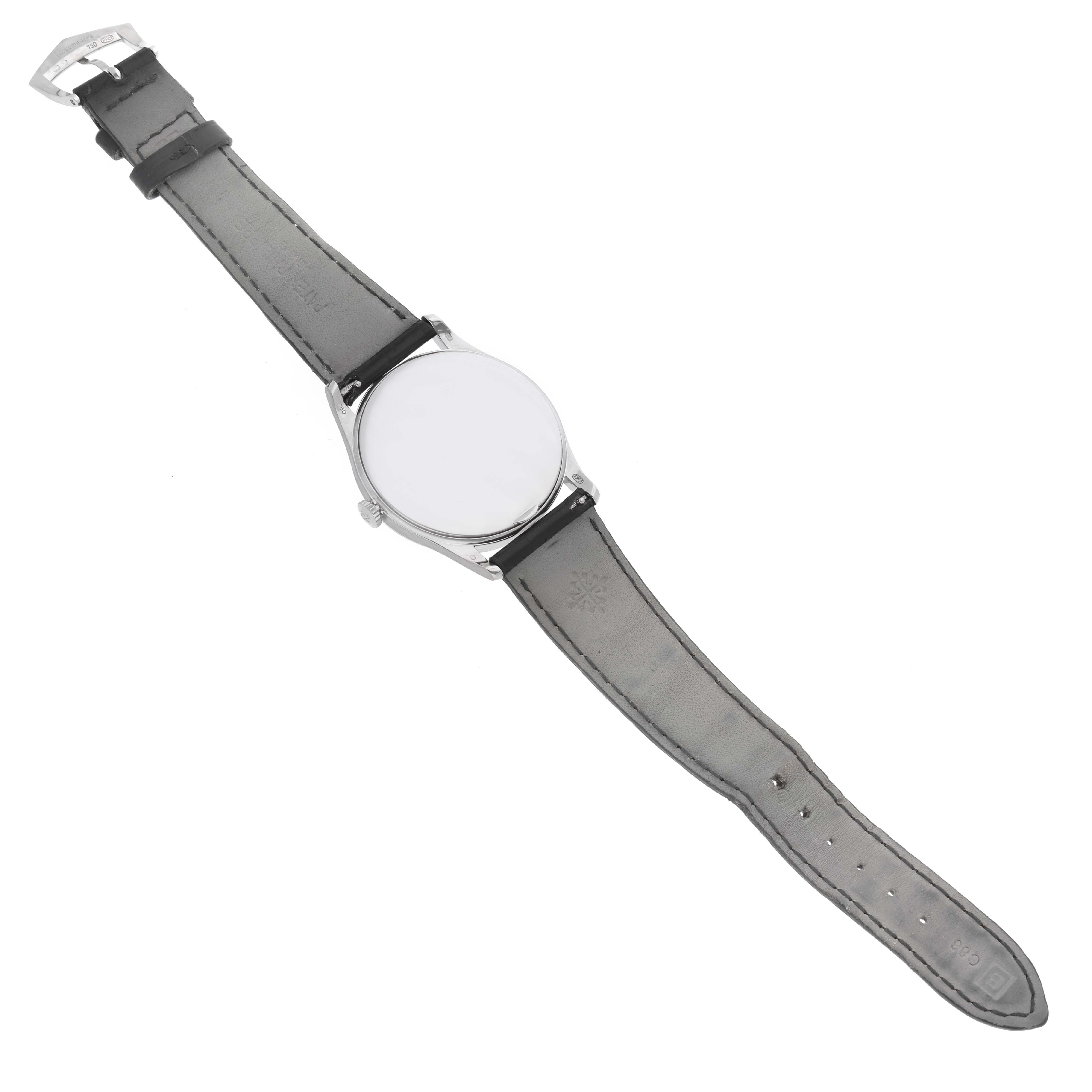 This image shows a Patek Philippe Calatrava 5196G Men
s White Gold Silver Dial 5196G Men
s White Gold Silver Dial model wristwatch laid flat, displaying its strap, case, and buckle from a top-down angle.