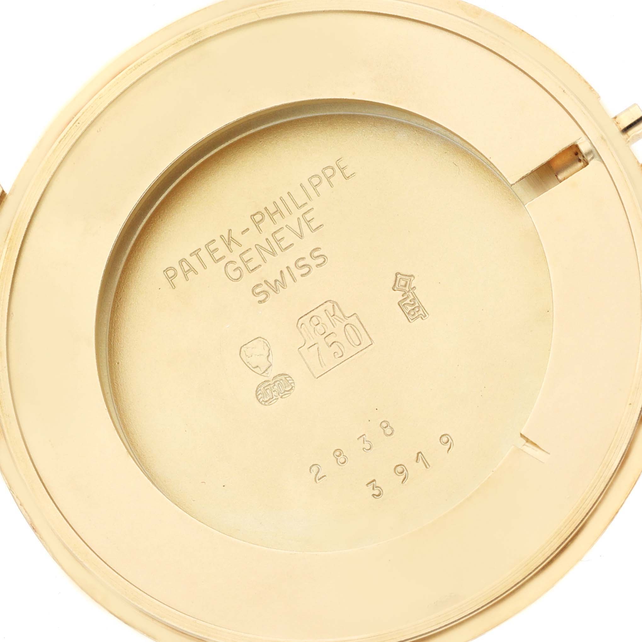 The image shows the back cover of a Patek Philippe Calatrava 3919J Men's Yellow Gold White Dial 3919J Men's Yellow Gold White Dial watch with engraved details.
