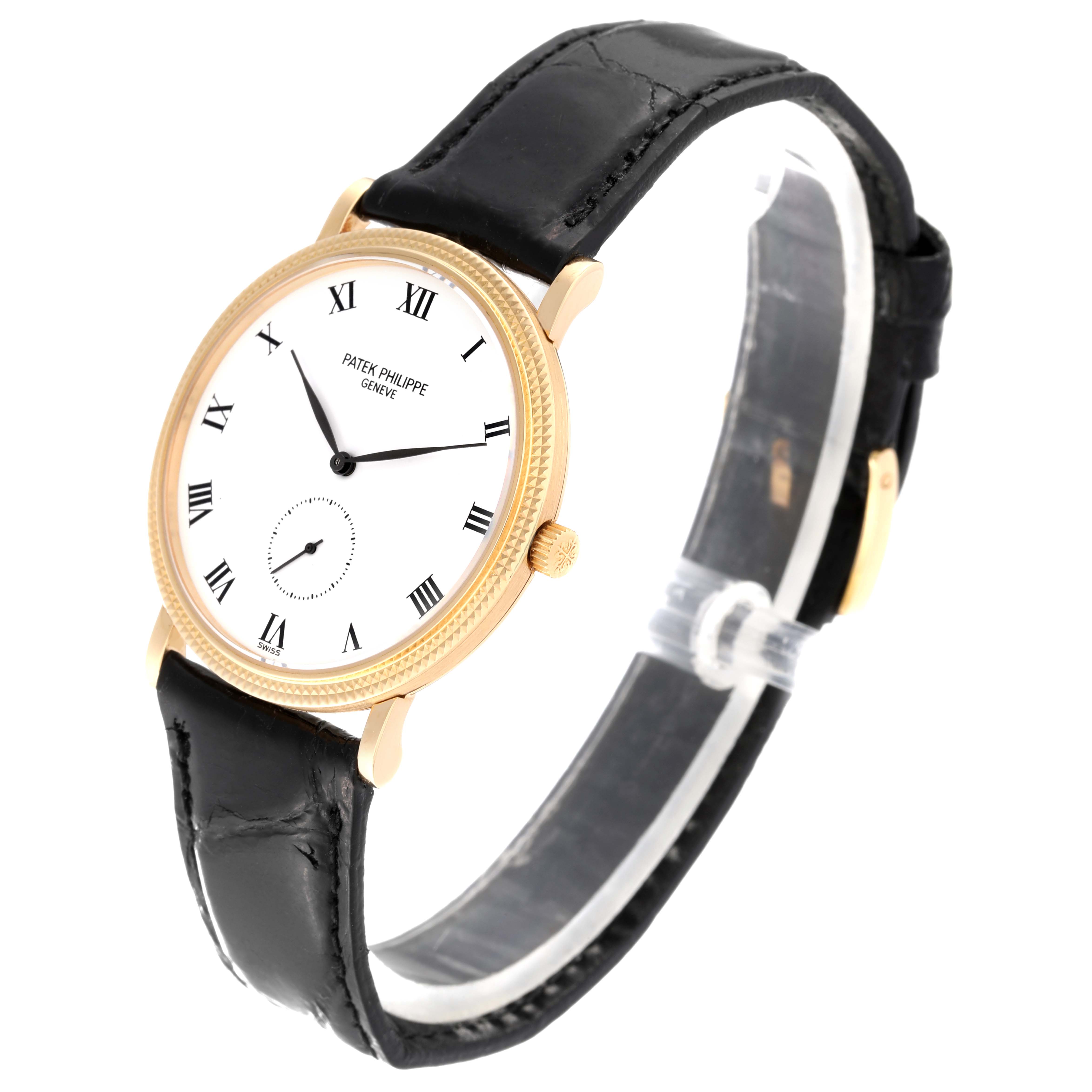 This Patek Philippe Calatrava 3919J Men's Yellow Gold White Dial 3919J Men's Yellow Gold White Dial watch is shown at a front-side angle, highlighting its dial, bezel, and leather strap.