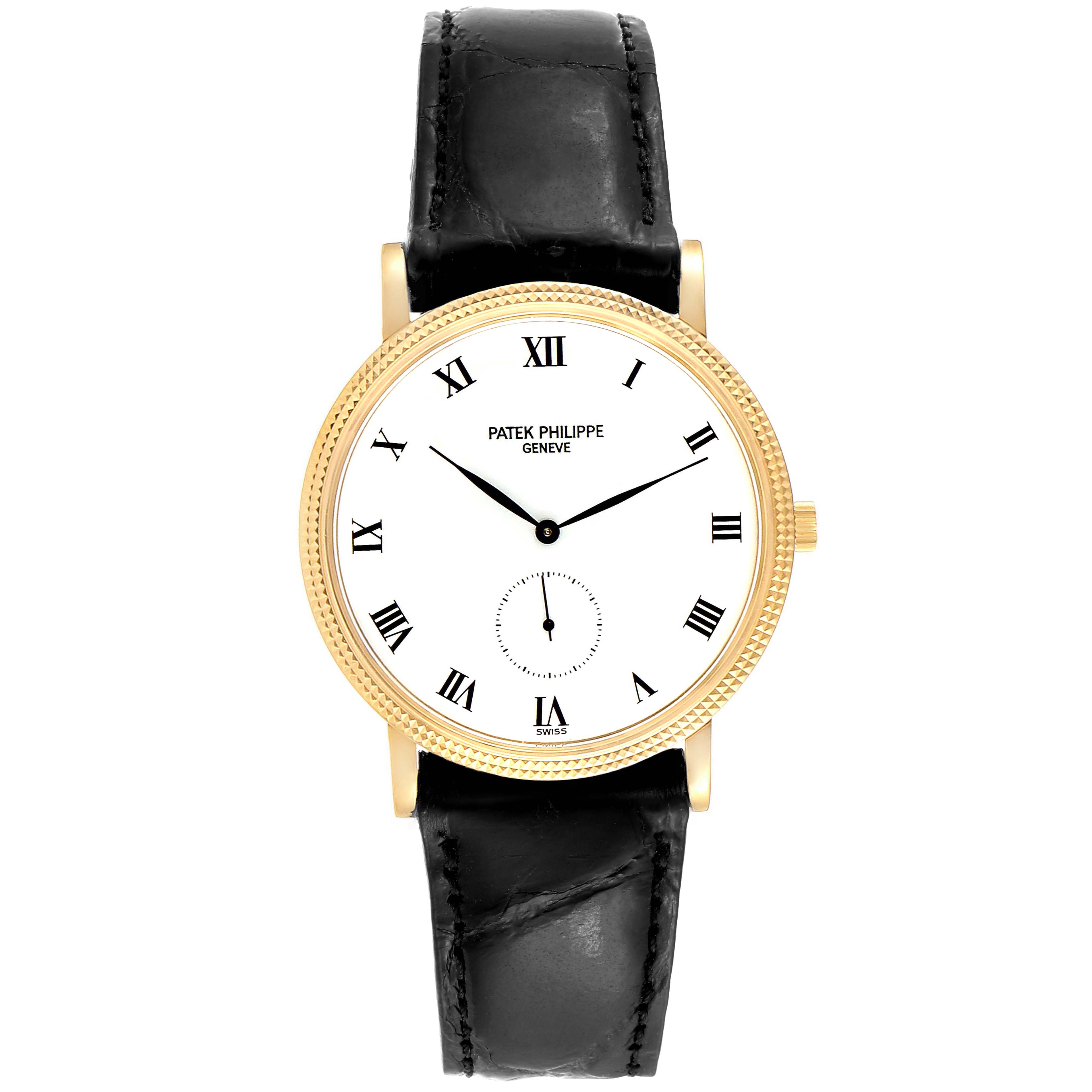 The image shows a frontal view of a Patek Philippe Calatrava 3919J Men's Yellow Gold White Dial 3919J Men's Yellow Gold White Dial watch with a gold case, white dial, black leather strap, and Roman numerals.