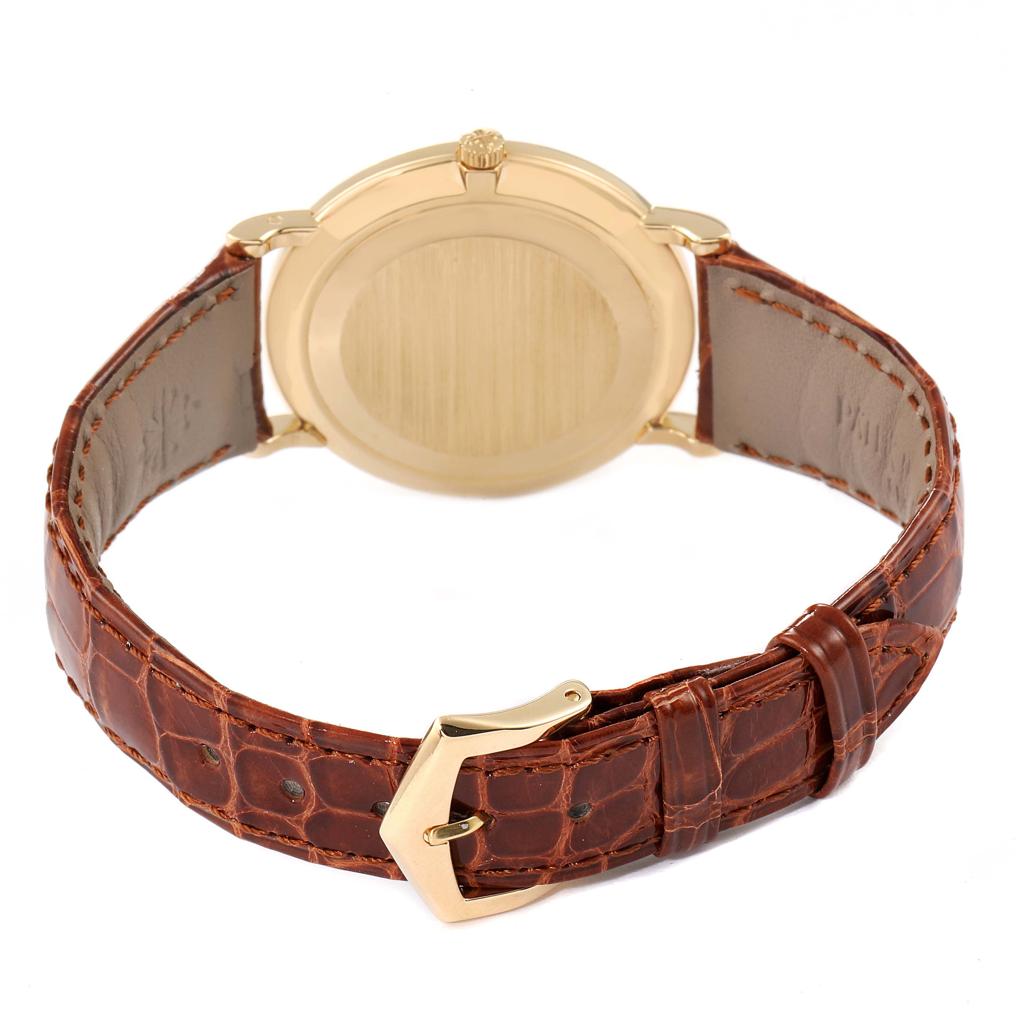 The image shows the back view of a Patek Philippe Calatrava 5022 Men's Yellow Gold White Dial 5022 Men's Yellow Gold White Dial watch, highlighting the case, crown, and leather strap with a buckle.