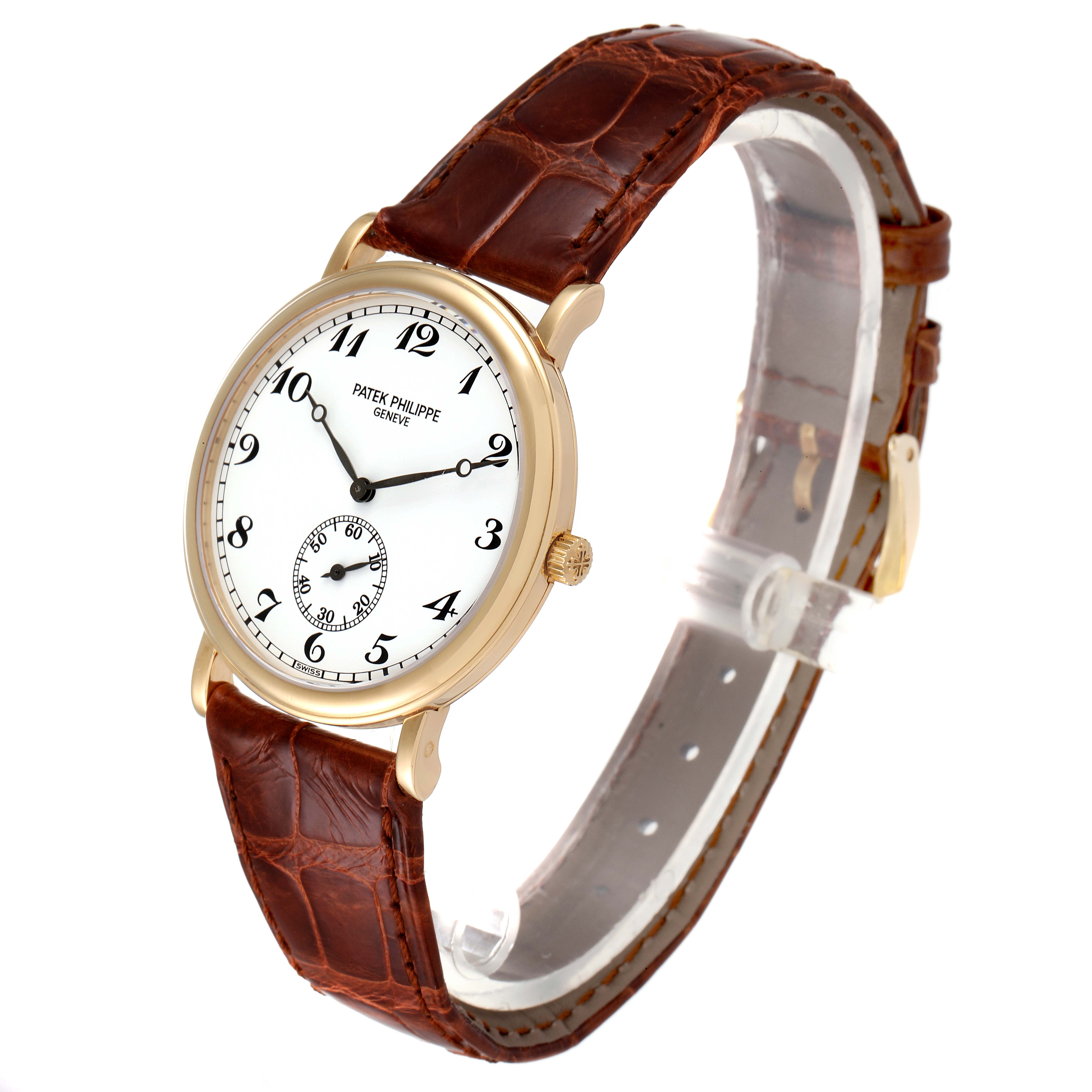 The image shows a Patek Philippe Calatrava 5022 Men's Yellow Gold White Dial 5022 Men's Yellow Gold White Dial watch with a brown leather strap viewed at a slight angle from the side and front.