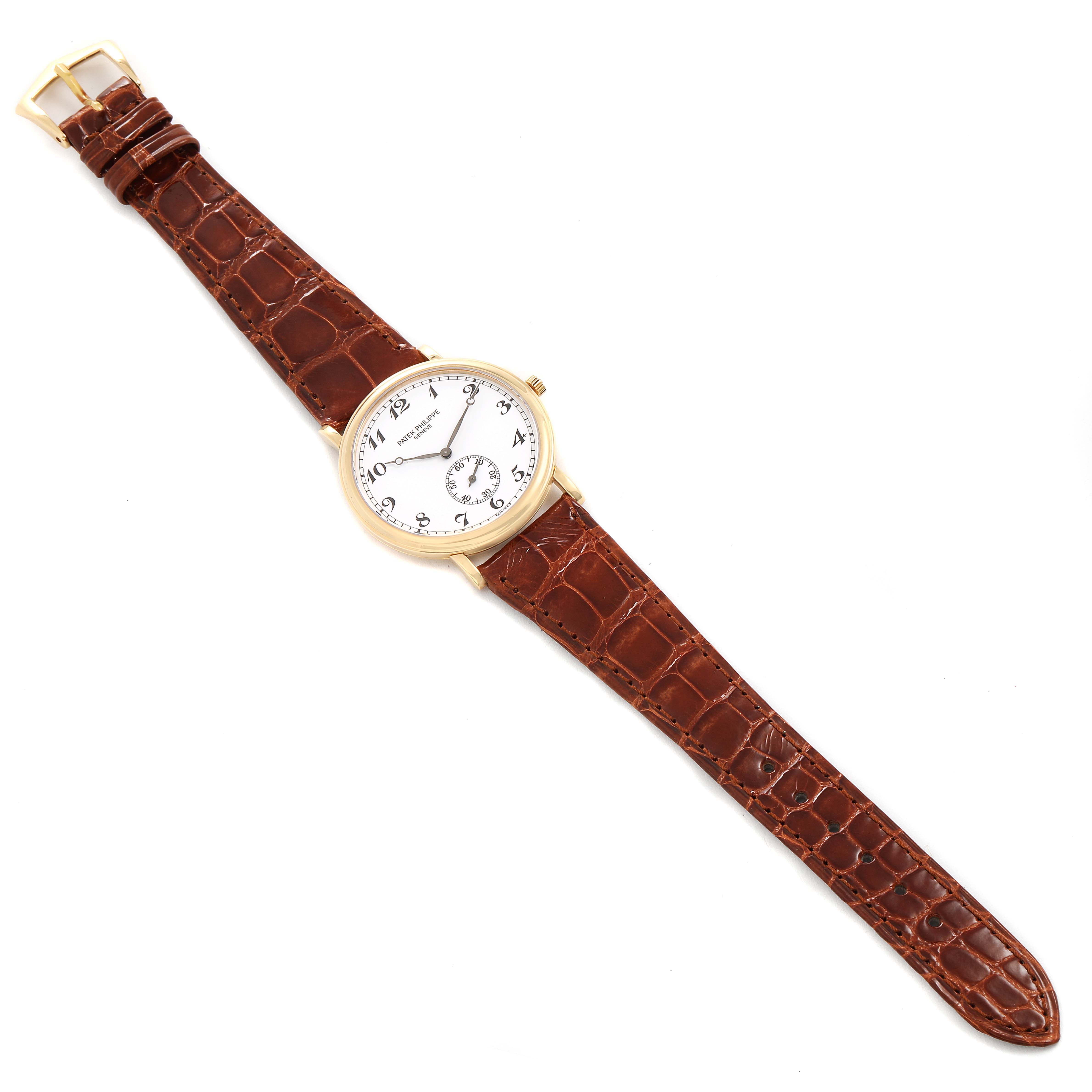 The Patek Philippe Calatrava 5022 Men's Yellow Gold White Dial 5022 Men's Yellow Gold White Dial watch is shown from a top-down angle, displaying its brown leather strap and white dial with Arabic numerals.