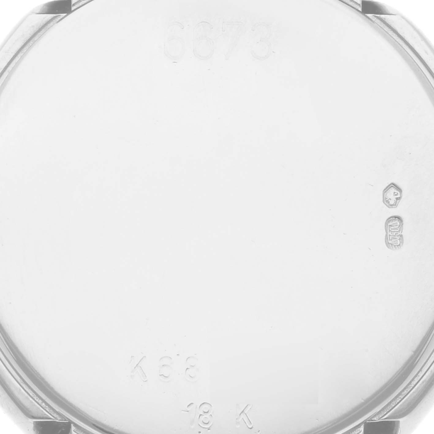 The image shows the back case of a Rolex Cellini 6673 Women's White Gold Silver Dial 6673 Women's White Gold Silver Dial watch, focusing on the inner side with engravings and hallmarks.