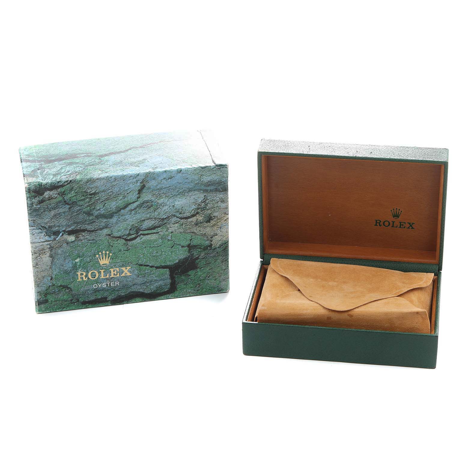 The image shows a Rolex Date 15210 Men's Stainless Steel Silver Dial model watch box and outer packaging, with the inner box open and a brown pouch inside.