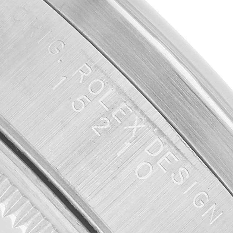 The image shows a close-up of the side engraving on the casing of a Rolex Date 15210 Men's Stainless Steel Silver Dial model watch.