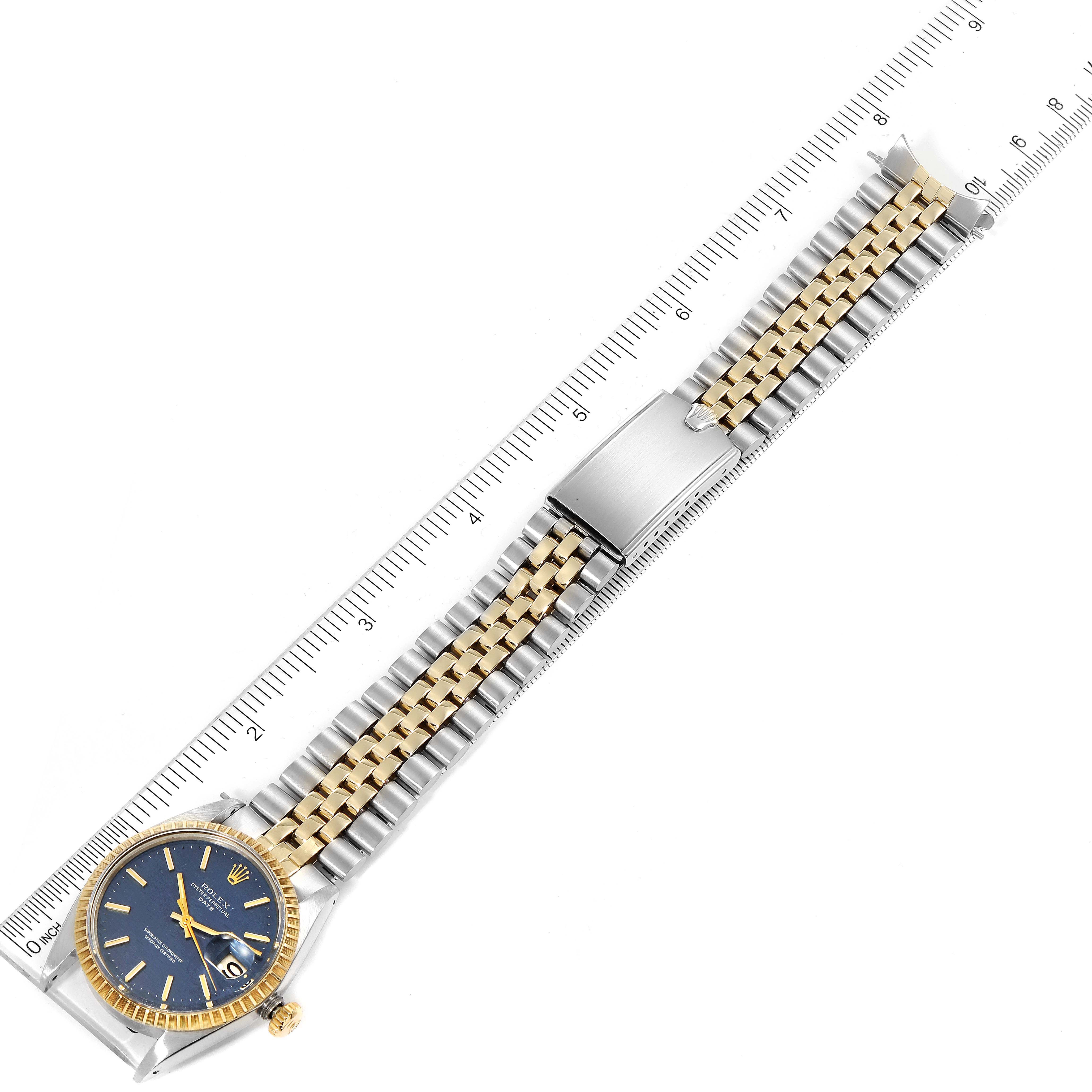 The Rolex Vintage Collection 1505 Men's Steel and Gold (two tone) Blue Dial 1505 Men's Steel and Gold (two tone) Blue Dial model watch is shown from a top view, displaying its face, strap, and clasp fully extended.