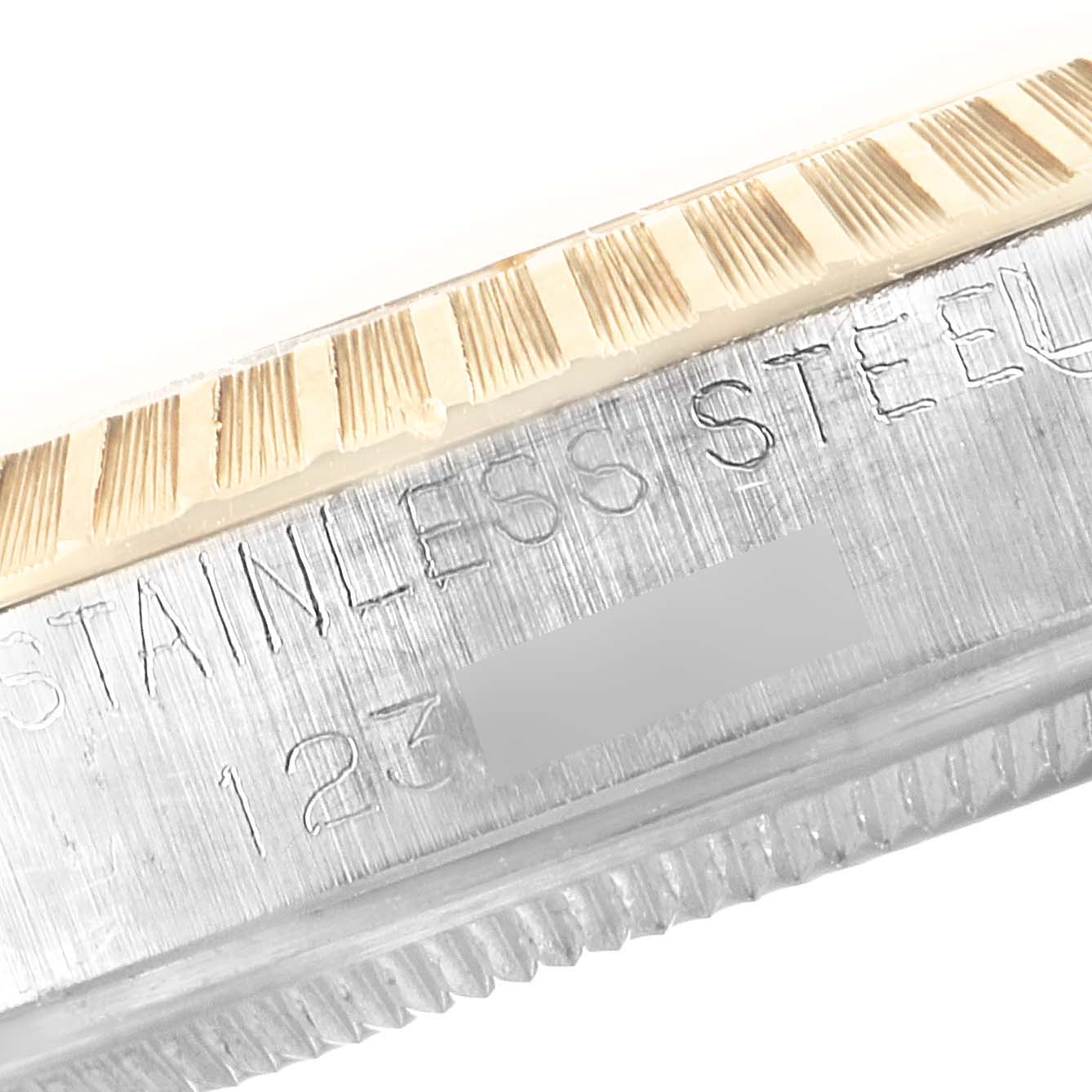 This close-up image features the bezel and engraved side of the case from a Rolex Vintage Collection 1505 Men's Steel and Gold (two tone) Blue Dial 1505 Men's Steel and Gold (two tone) Blue Dial model.