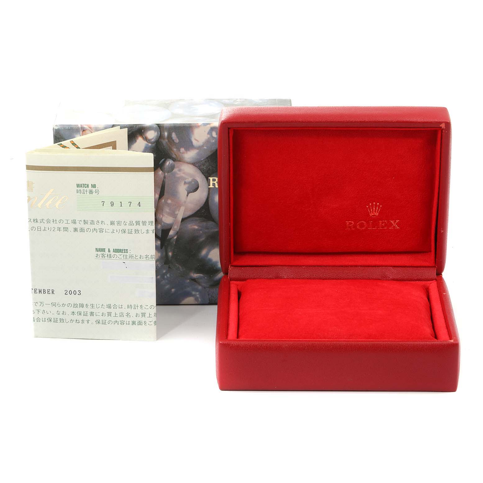 The image shows an empty red Rolex Datejust 79174 Women
s Stainless Steel Silver Dial 79174 Women
s Stainless Steel Silver Dial watch box and accompanying paperwork, including the warranty card.