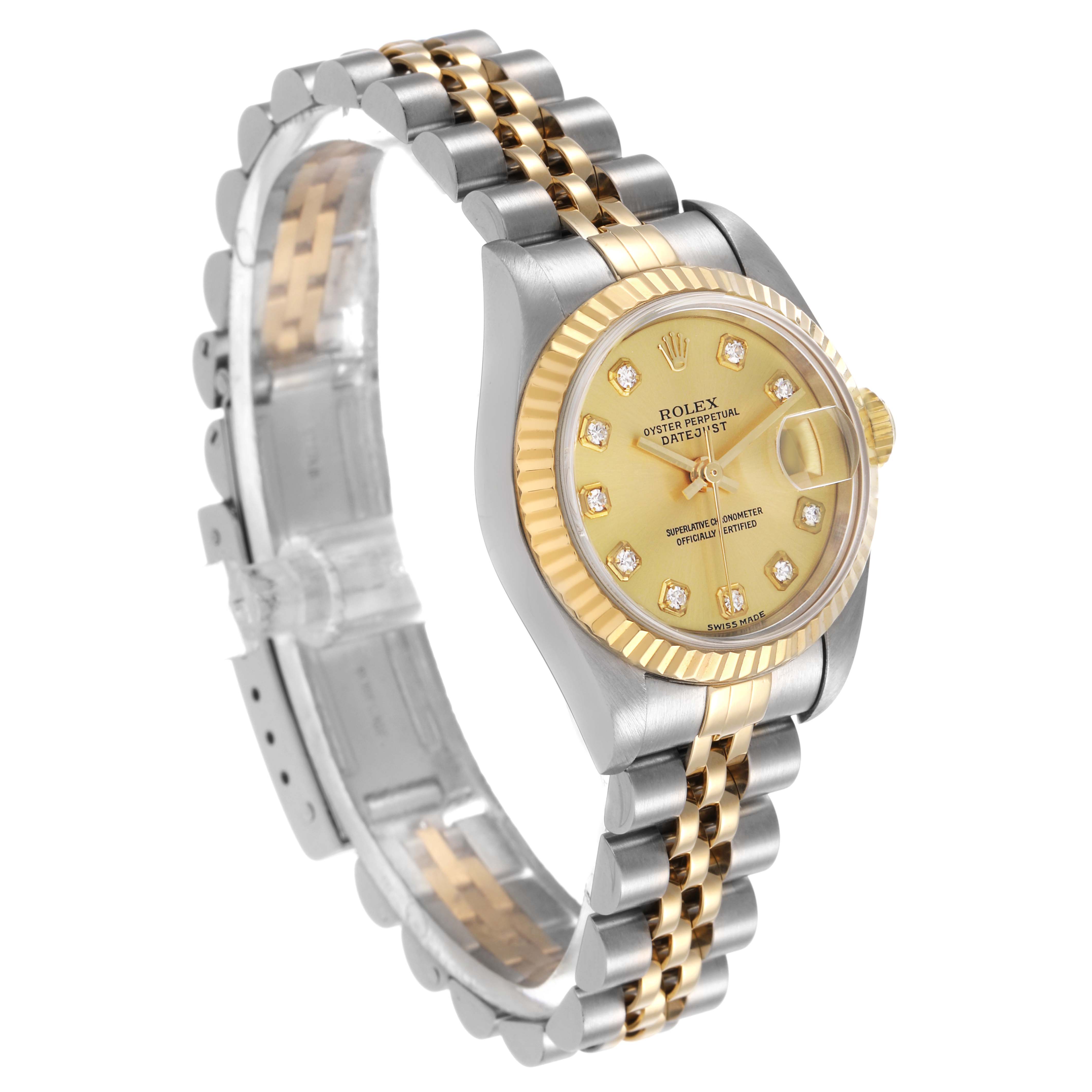 The image shows the Rolex Datejust 79173 Women's Steel and Gold (two tone) Champagne Dial watch from an angled side view, highlighting its gold dial, bezel, and two-tone bracelet.