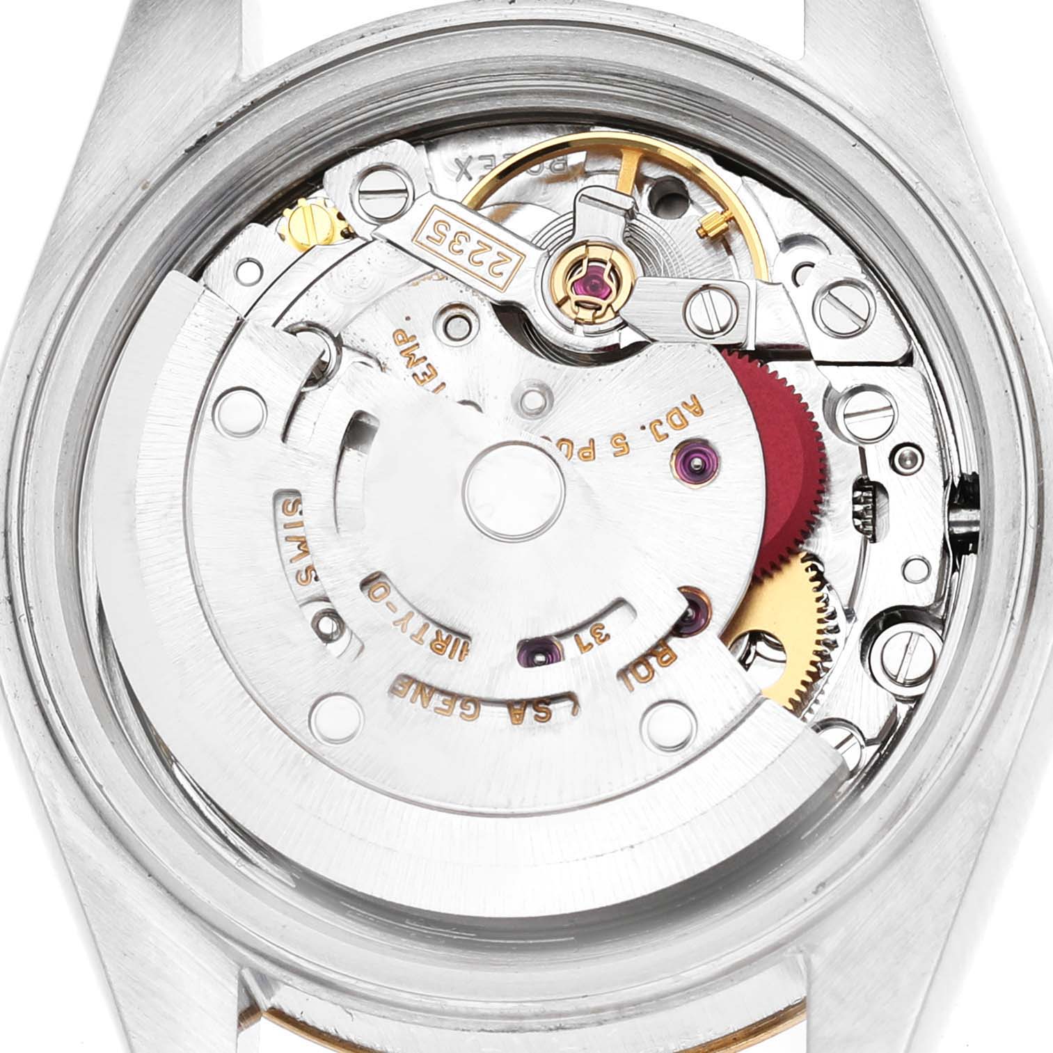 The image shows the internal movement of a Rolex Datejust 79173 Women's Steel and Gold (two tone) Champagne Dial watch from a top-down angle, highlighting gears and mechanisms.