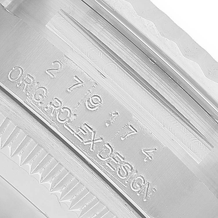 The image shows an engraving on the inner case of a Rolex Datejust 279174 Women's Stainless Steel Silver Dial watch.