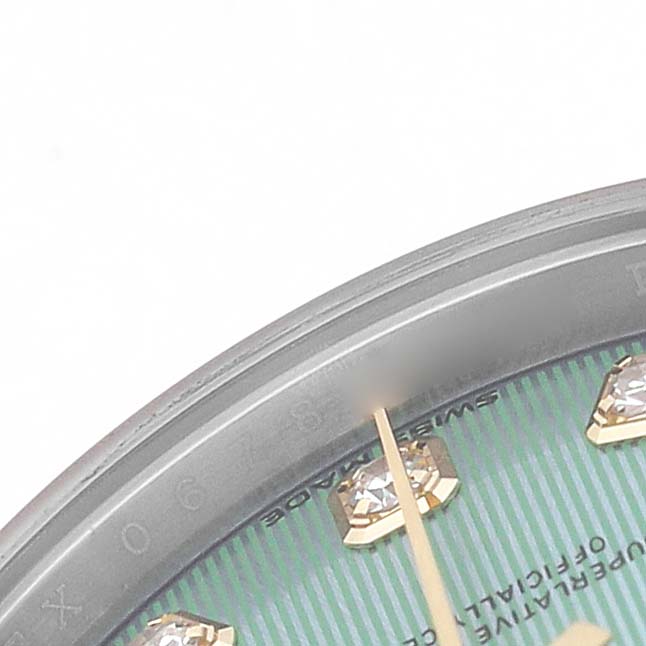 The image shows a partial view of the Rolex Datejust 279383RBR Women's Steel and Gold (two tone) Green Dial dial, focusing on the hour markers and part of the bezel.