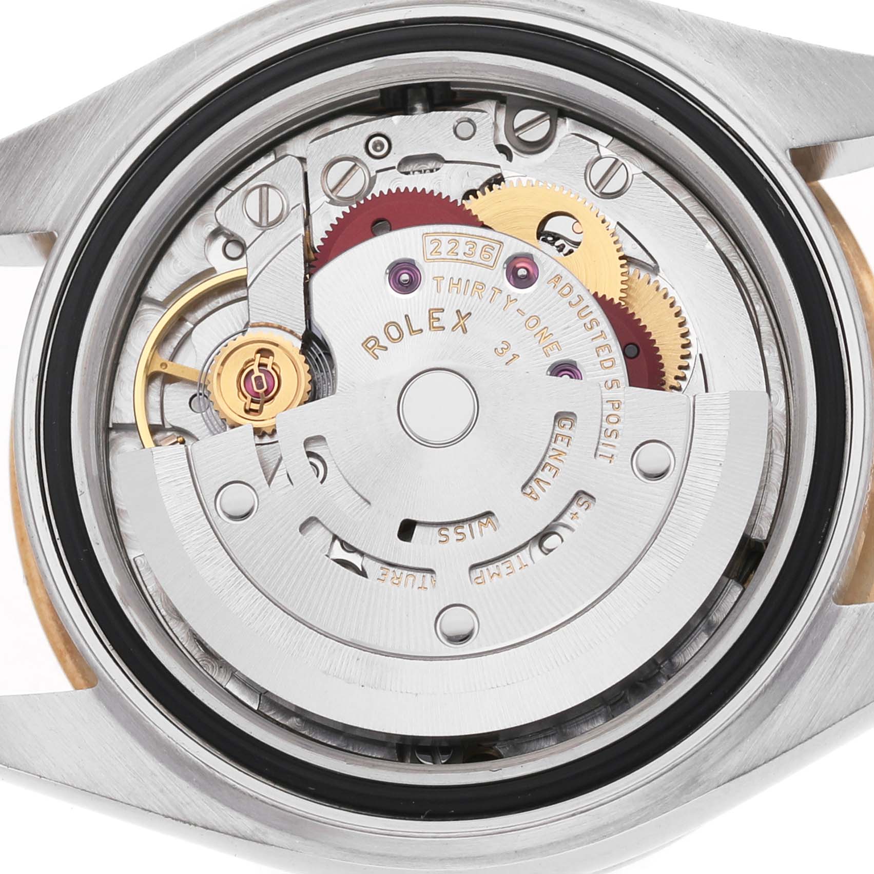 The image shows the movement mechanism of a Rolex Datejust 279383RBR Women's Steel and Gold (two tone) Green Dial watch from a back angle, detailing gears and the rotor.